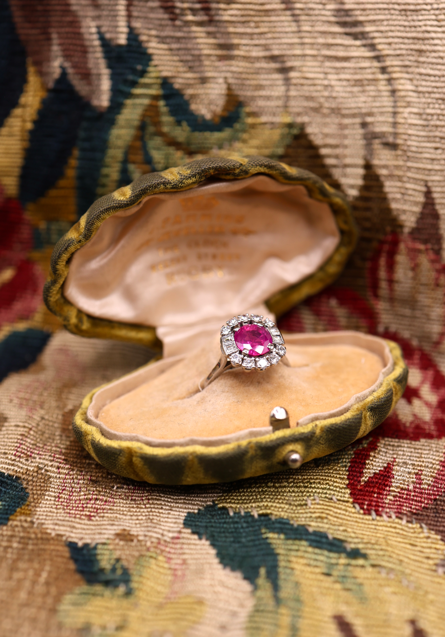 An extraordinary 2.30 Carat Natural Untreated Burmese Ruby & Diamond Cluster Ring in 18 ct. (stamped) White Gold. English, Circa 1970