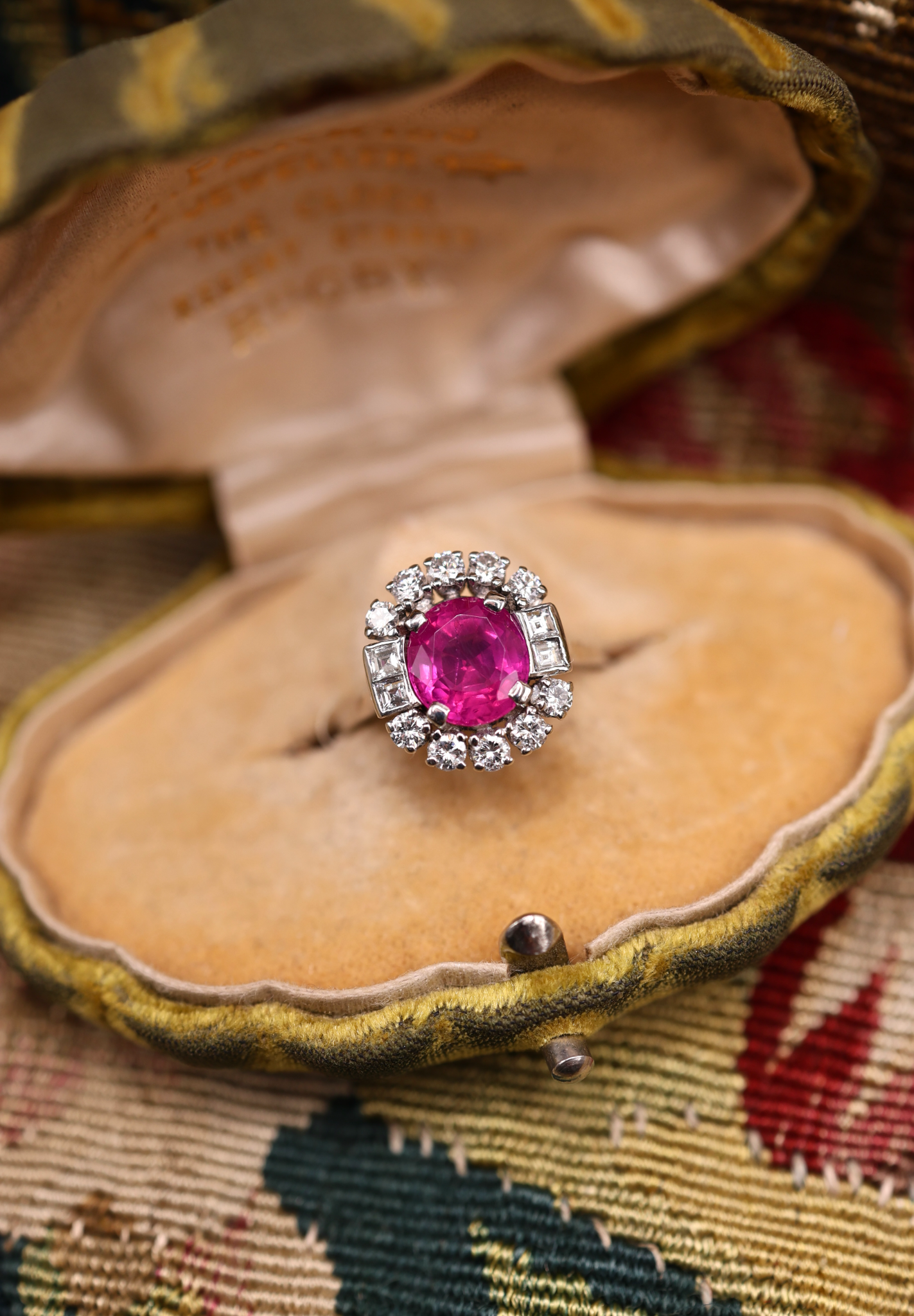 An extraordinary 2.30 Carat Natural Untreated Burmese Ruby & Diamond Cluster Ring in 18 ct. (stamped) White Gold. English, Circa 1970