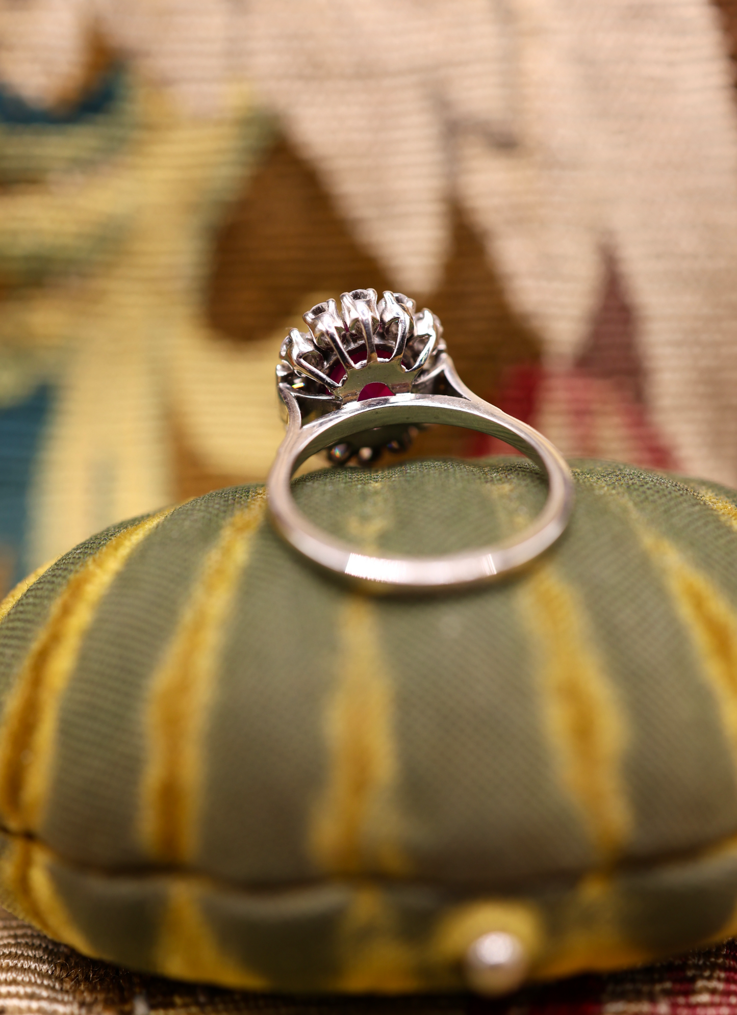 An extraordinary 2.30 Carat Natural Untreated Burmese Ruby & Diamond Cluster Ring in 18 ct. (stamped) White Gold. English, Circa 1970