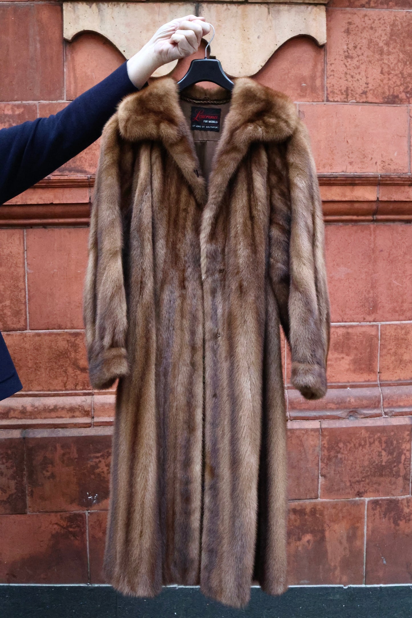 An Exceptional Full Length Demi-Buff, Fully Stranded Mink Coat with wide Raglan Sleeves, tapering to Mandarin Cuffs and a generous Swing Back. Hand made by Lawrence's of Southport. Circa 1990