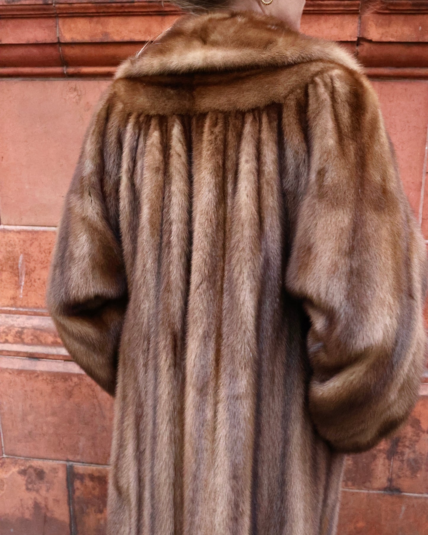 An Exceptional Full Length Demi-Buff, Fully Stranded Mink Coat with wide Raglan Sleeves, tapering to Mandarin Cuffs and a generous Swing Back. Hand made by Lawrence's of Southport. Circa 1990