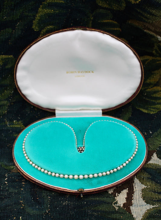 A very fine Graduated Natural Pearl Necklace with a High Carat and Silver Old Cut Diamond Set Clasp. Circa 1920 - Robin Haydock Antiques