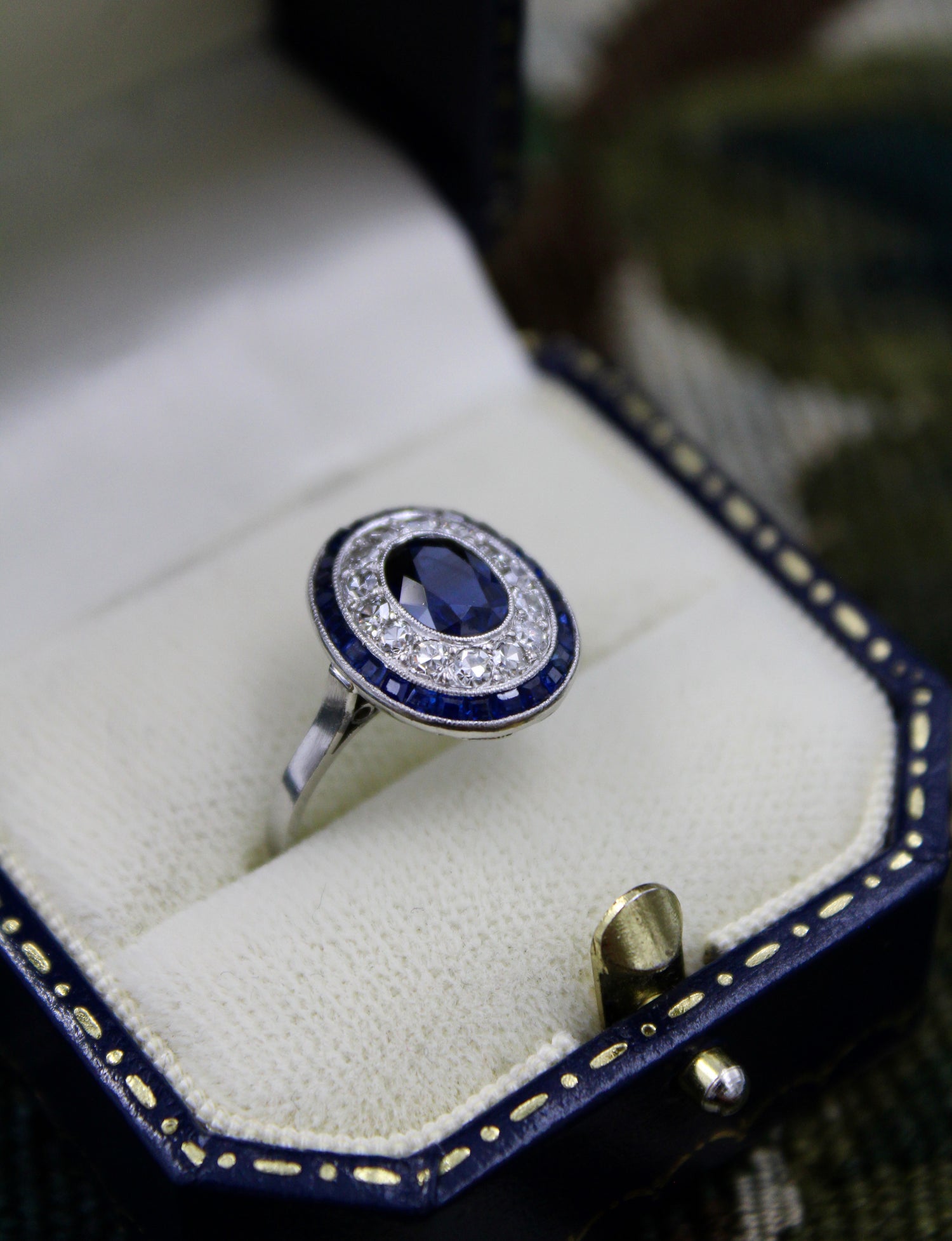A very fine Platinum, Diamond & Sapphire Oval Target Ring, centrally Rub-over set with an Unheated Burma Sapphire. French. Circa 1930. - Robin Haydock Antiques