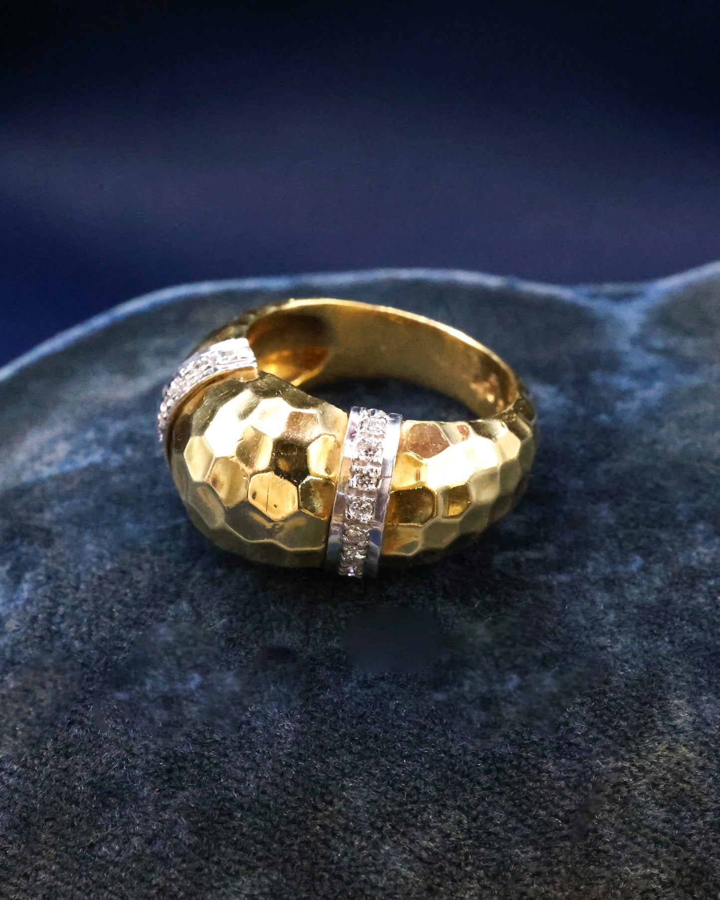A very finely hammered 18 ct Yellow Gold & Platinum (marked) Ring, with two cordons in Platinum, each set with ten small round cut Diamonds (20 in total). Continental. Circa 1960