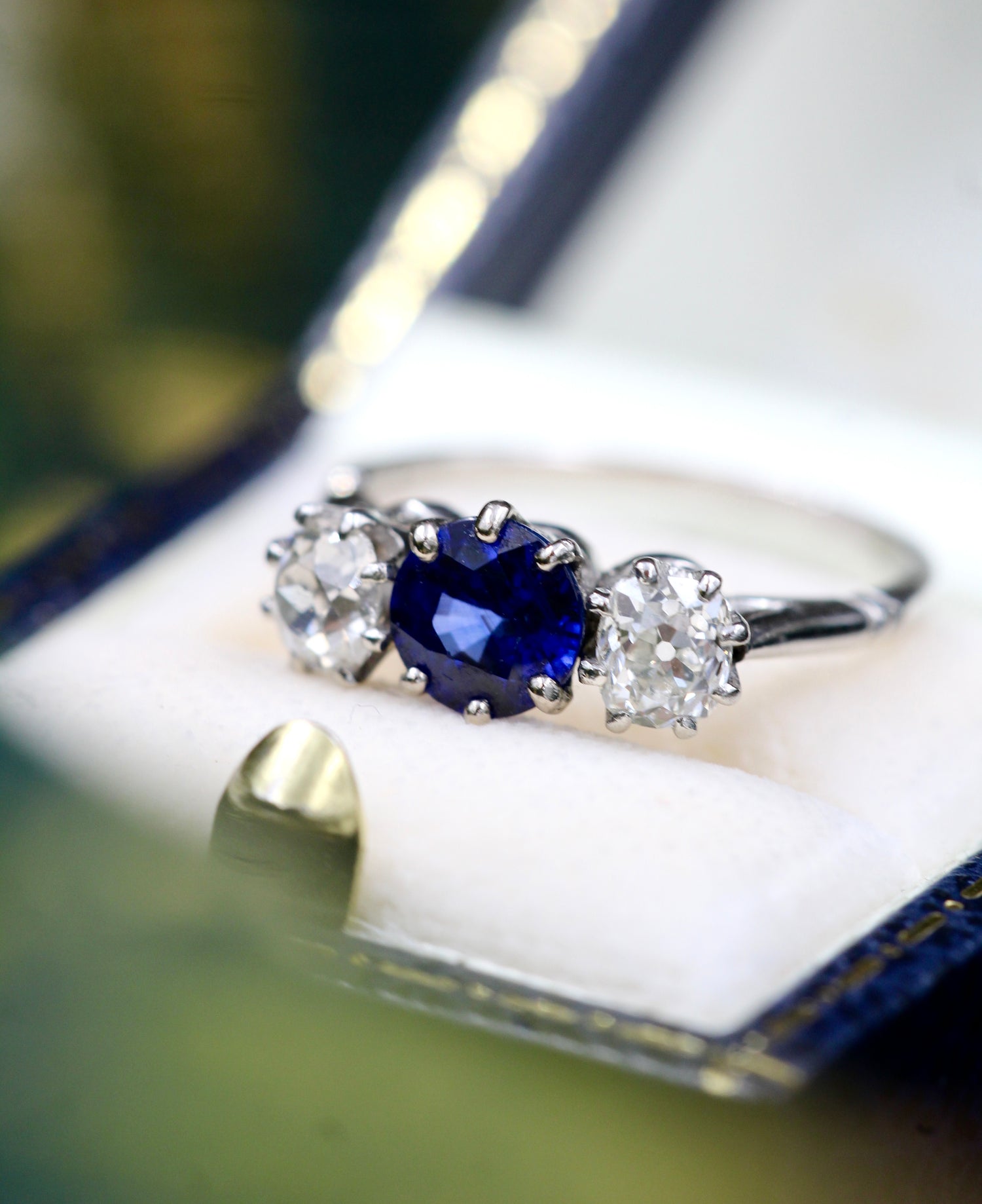 A very beautiful 1.45 Carat Natural Ceylon Sapphire and (two) Old Mine Cut Diamond & Platinum Engagement Ring. Circa 1930 - Robin Haydock Antiques