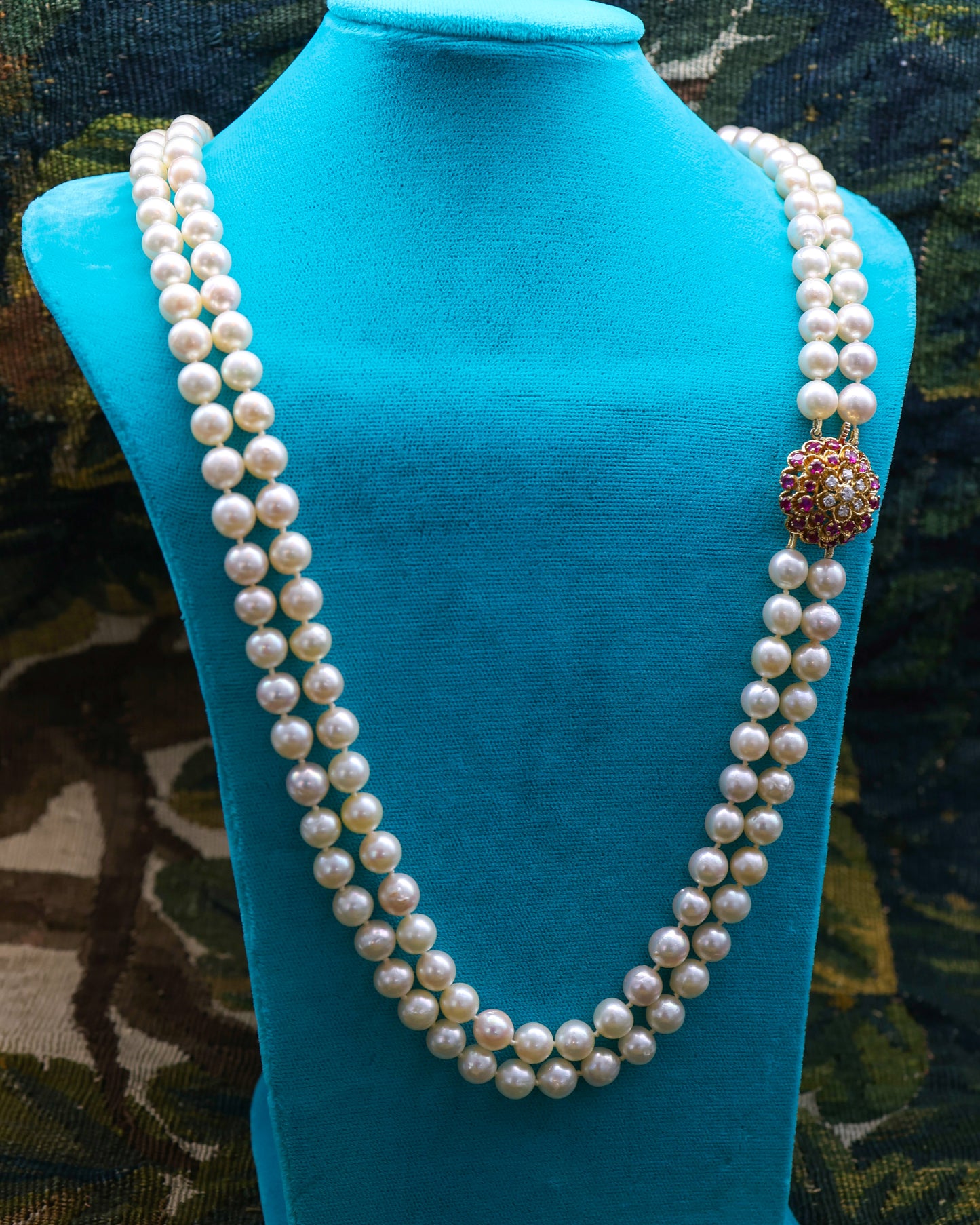 A very fine 18ct Yellow Gold  "Kutchinsky"(Signed), Double Stranded Akoya , Cultured Pearl Necklace, with a Clasp, set throughout with Burma Untreated Rubies & Diamonds. English. Circa 1950