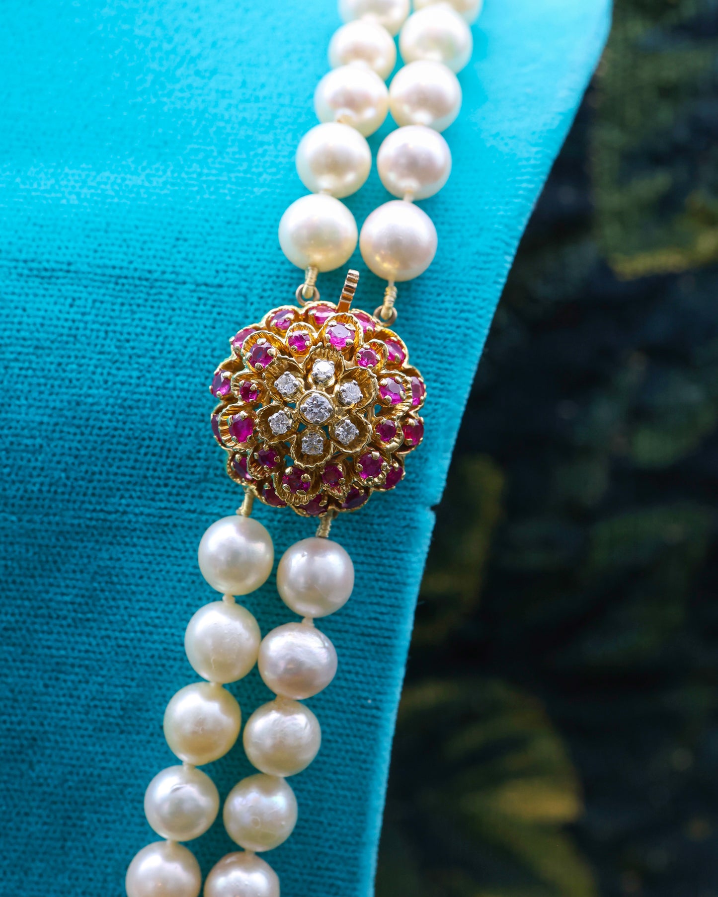 A very fine 18ct Yellow Gold  "Kutchinsky"(Signed), Double Stranded Akoya , Cultured Pearl Necklace, with a Clasp, set throughout with Burma Untreated Rubies & Diamonds. English. Circa 1950