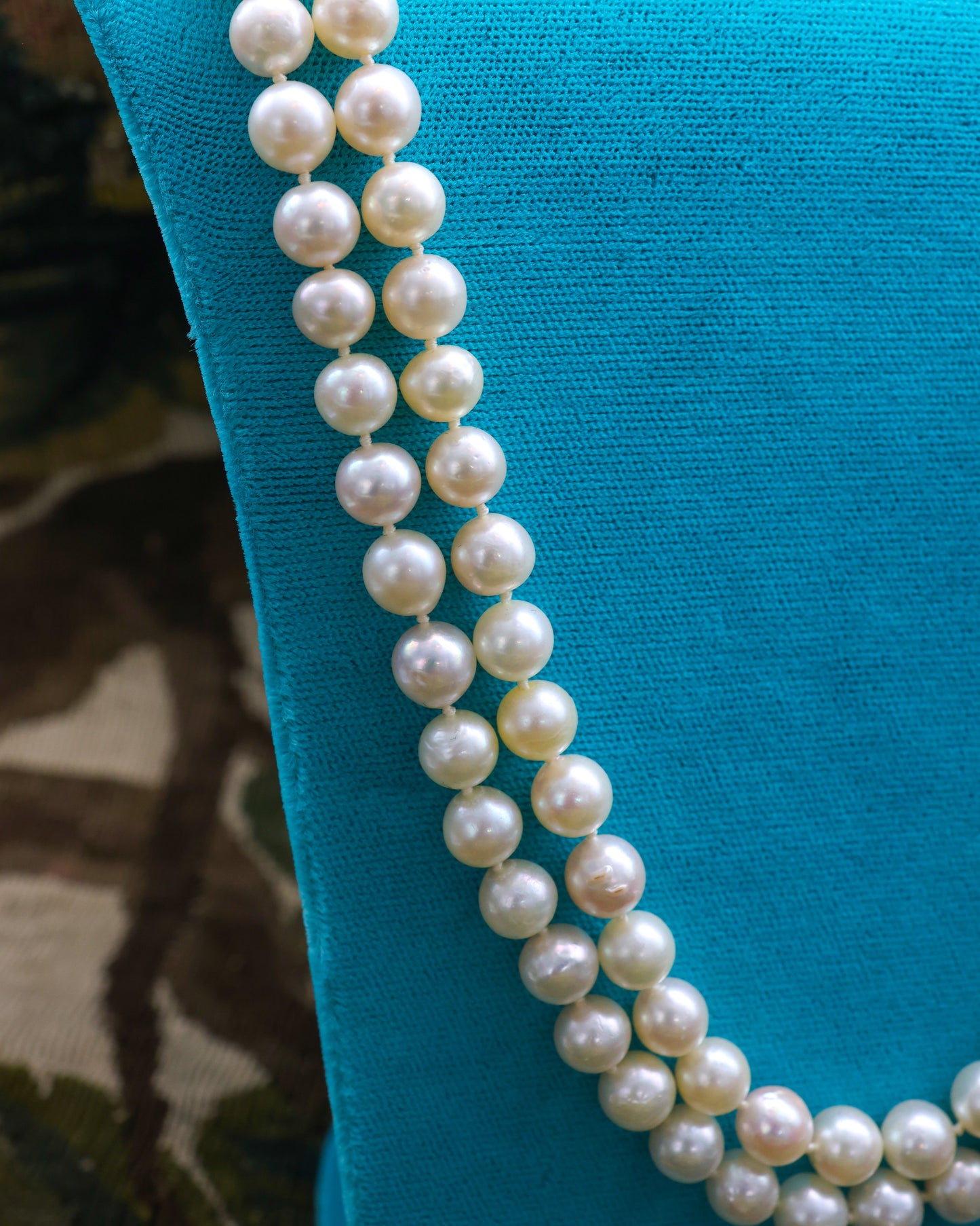 A very fine 18ct Yellow Gold  "Kutchinsky"(Signed), Double Stranded Akoya , Cultured Pearl Necklace, with a Clasp, set throughout with Burma Untreated Rubies & Diamonds. English. Circa 1950