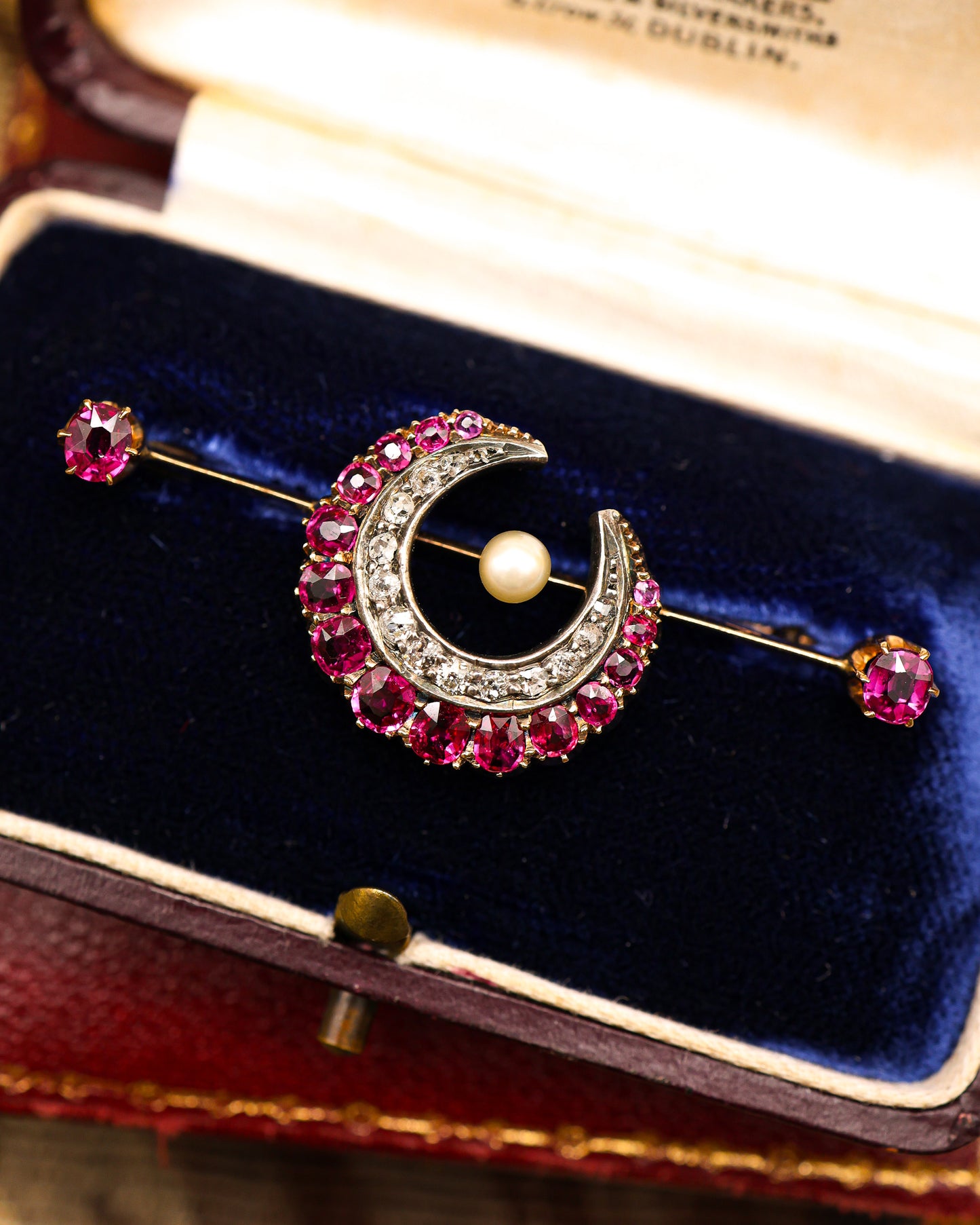 A very fine Victorian, Rose Gold & Silver, "Siam" Ruby, Natural Pearl and Diamond Crescent Brooch, with satellite Rubies. English Circa 1880