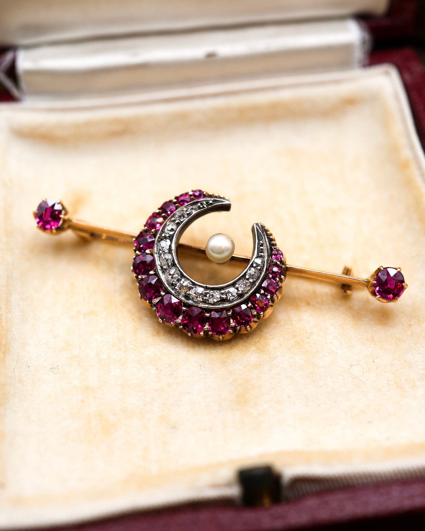 A very fine Victorian, Rose Gold & Silver, "Siam" Ruby, Natural Pearl and Diamond Crescent Brooch, with satellite Rubies. English Circa 1880