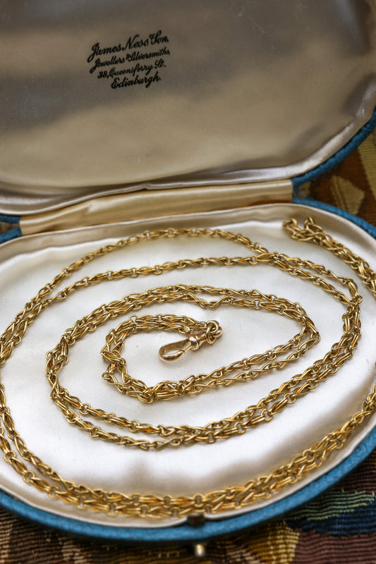 A very fine 15 carat (stamped), Yellow Gold Antique Long Guard Chain, with a matching 15 carat (stamped), Yellow Gold  Lobster Claw Clasp,  English, Circa 1880 - Robin Haydock Antiques