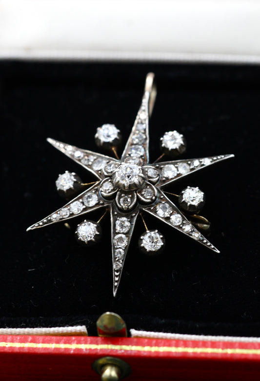 A very fine High Carat Yellow Gold & Silver 6 pointed Diamond Starburst Pendant / Brooch.  Engish. Circa 1880.