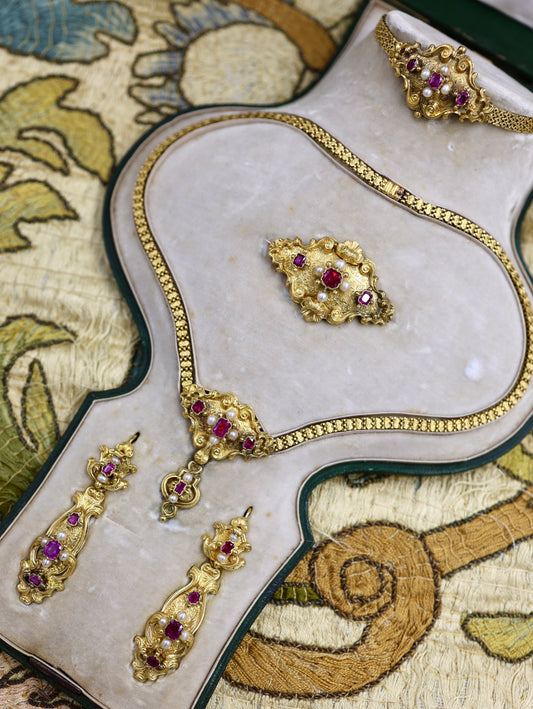 A Beautiful example of a very fine Antique 18ct Yellow Gold, Untreated Burmese Ruby and Seed Pearl, French Parure in the original box. Circa 1825