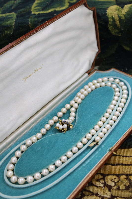 A fine Yellow Gold & Strung Cultured Pearl Necklace, set with four Round Cut Natural Sapphires (0.40 carats) and eighty three Oval and Near Shaped Cultured Pearls. Circa 1960 - Robin Haydock Antiques