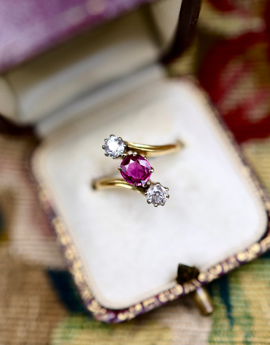 A very fine Natural and Untreated, 1.20 Carat Ruby & Diamond, Three Stone Crossover Ring, in 18 Carat Yellow Gold (stamped). Circa 1930