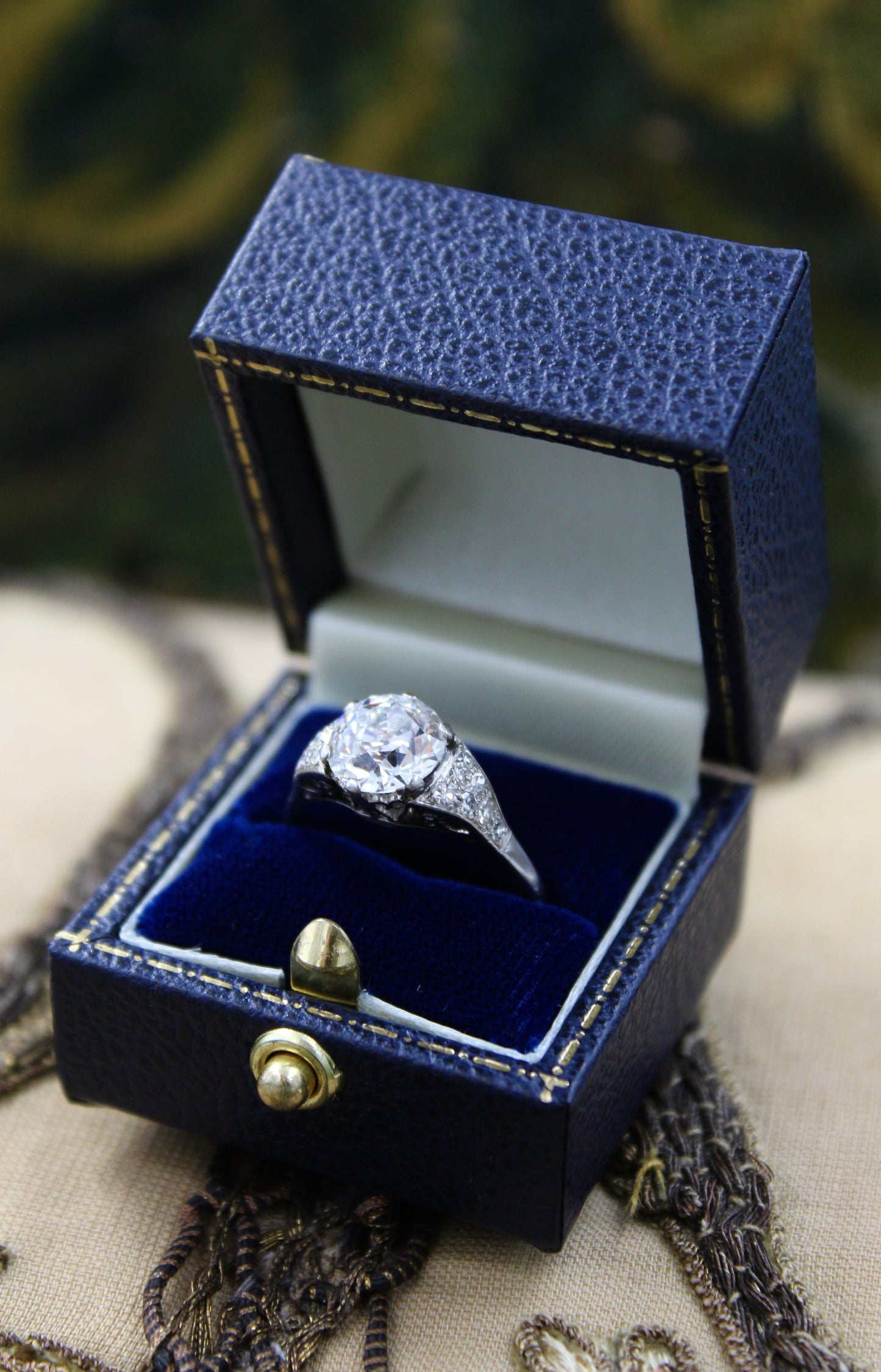 A very fine Platinum & Diamond Solitaire Ring, set with an Old European Cut Diamond, of 2.18 Carats, G Colour and SI1 Clarity. Offset by graduated Diamond Shoulders. Circa 1925 - Robin Haydock Antiques