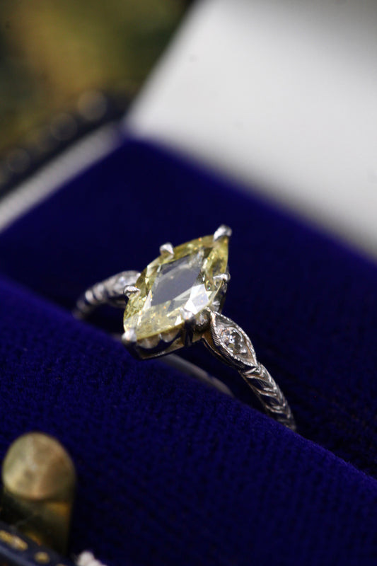 An excellent Platinum (tested) Marquise Shaped Natural and Untreated Fancy Yellow Diamond Solitaire Ring. Circa 1930. - Robin Haydock Antiques