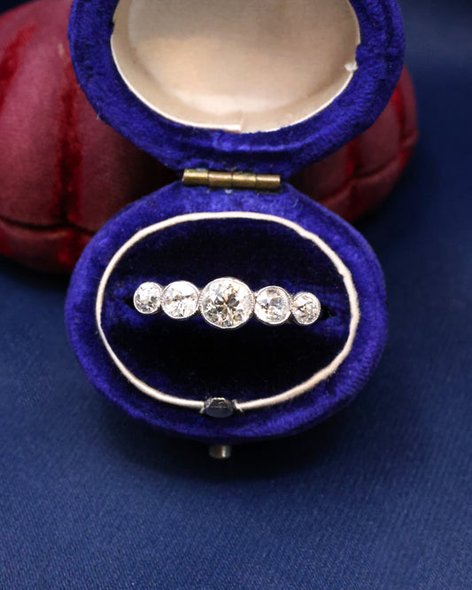 A very fine 18ct. White Gold (later rhodium plated), graduating five stone Diamond Ring, rub-over and granulated set with five Old European Cut, Natural Diamonds. Circa 1930 - Robin Haydock Antique Jewellery