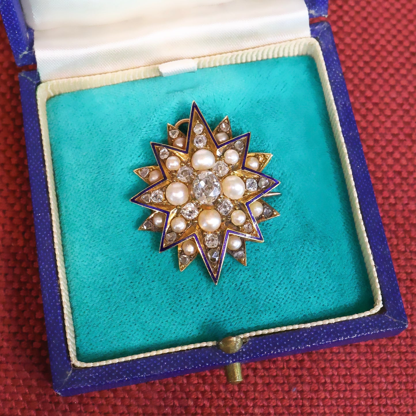 A very beautiful High Carat Gold (tested), Diamond &  Natural Pearl Star Pendant / Brooch with Blue Enamel Highlights Circa 1880