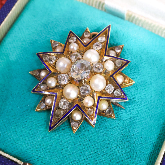 A very beautiful High Carat Gold (tested), Diamond & Natural Pearl Star Pendant / Brooch with Blue Enamel Highlights Circa 1880