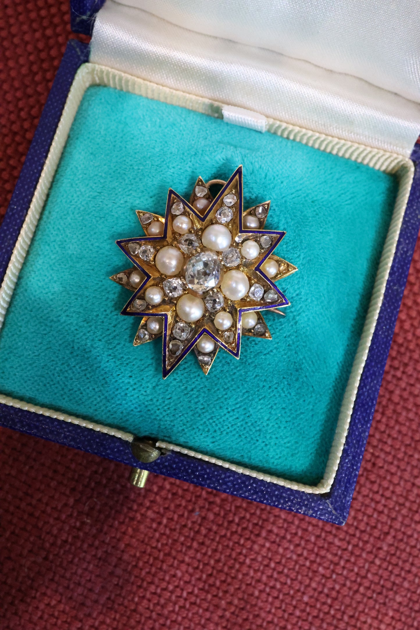A very beautiful High Carat Gold (tested), Diamond &  Natural Pearl Star Pendant / Brooch with Blue Enamel Highlights Circa 1880