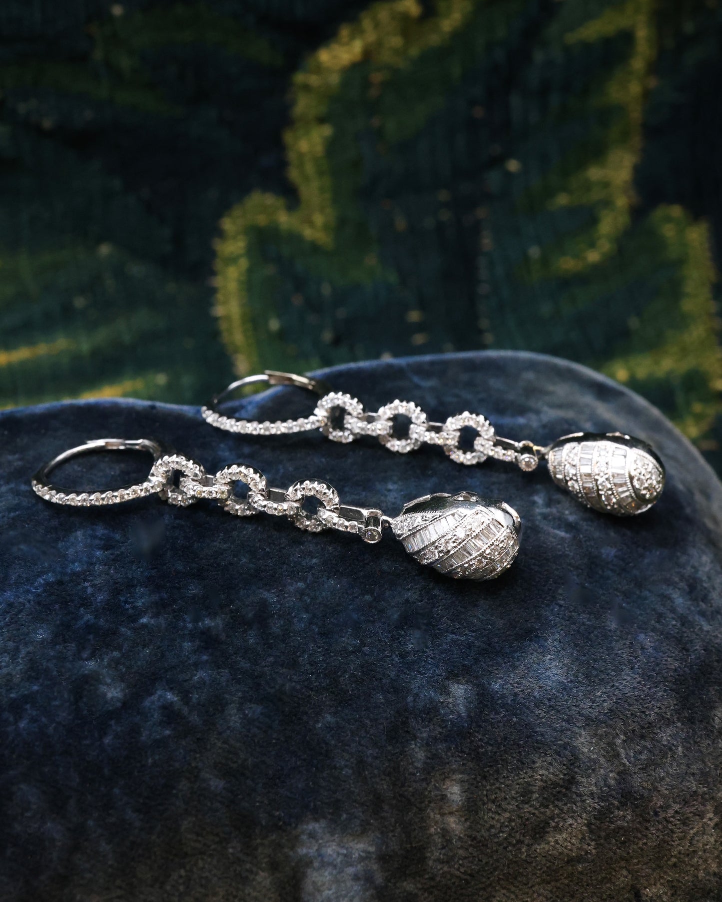 A fine pair of 18ct White Gold (marked), Round Brilliant & Emerald Cut Diamond Drop Earrings. approximately 1.35 Carats (unweighed). Pre-owned.