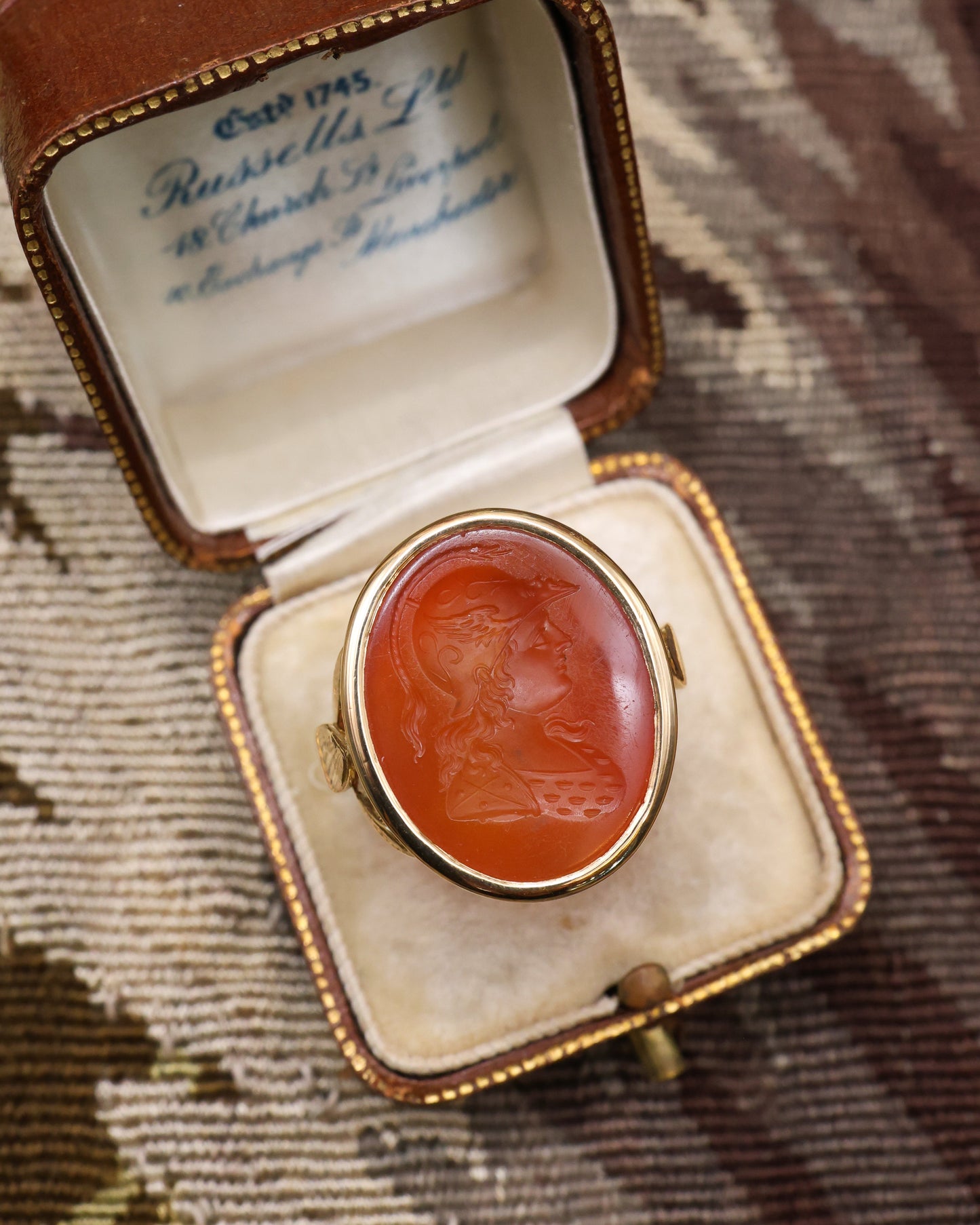 An unusually heavy 18ct Yellow Gold (tested), Oval Carnelian Intaglio ring, finely carved with the image of a warrior wearing a Winged Helmet (Hermes - Mercury), partial hallmarks. English. Circa 1890