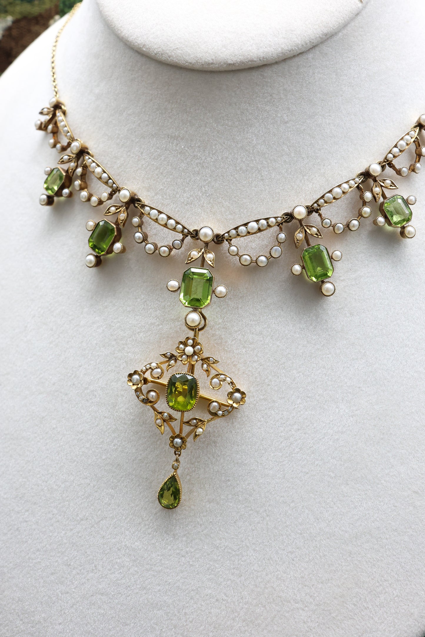 An exquisite Peridot & Seed Pearl Festoon Necklace with a matching Quatrefoil style detachable Pendant/Brooch in 15 Carat Yellow Gold, English, Circa 1900 - Robin Haydock Antique Jewellery