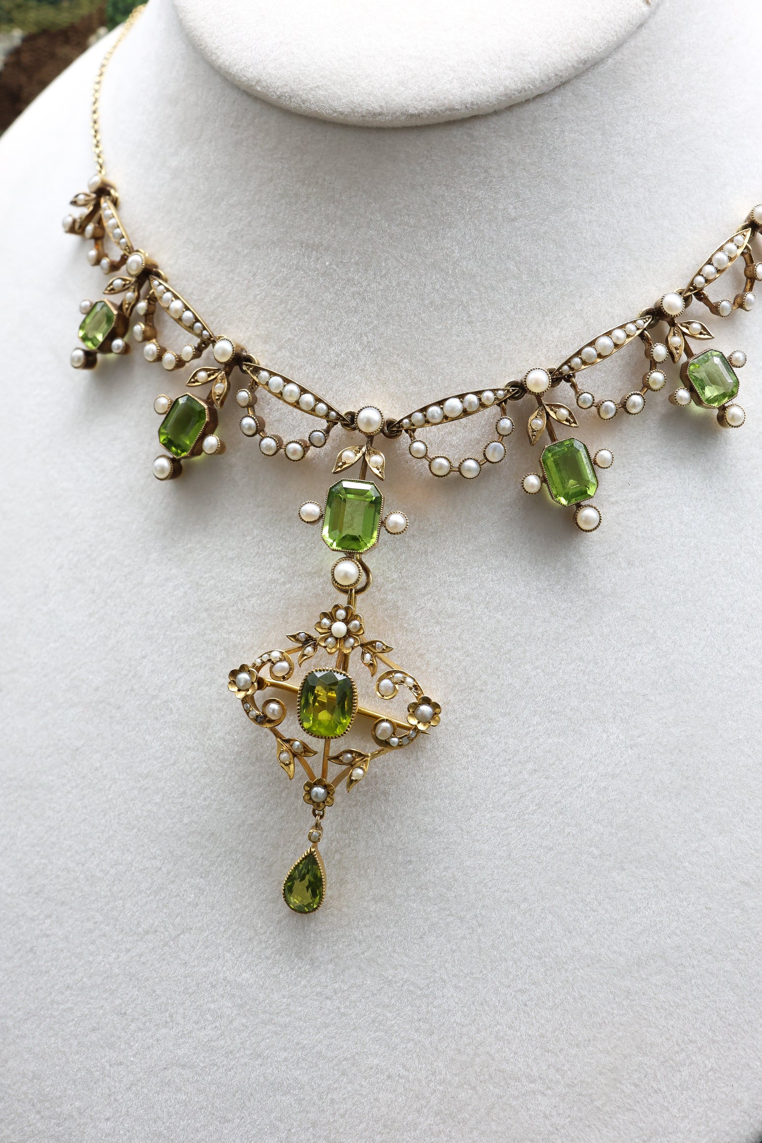 An exquisite Peridot & Seed Pearl Festoon Necklace with a matching Quatrefoil style detachable Pendant/Brooch in 15 Carat Yellow Gold, English, Circa 1900 - Robin Haydock Antique Jewellery