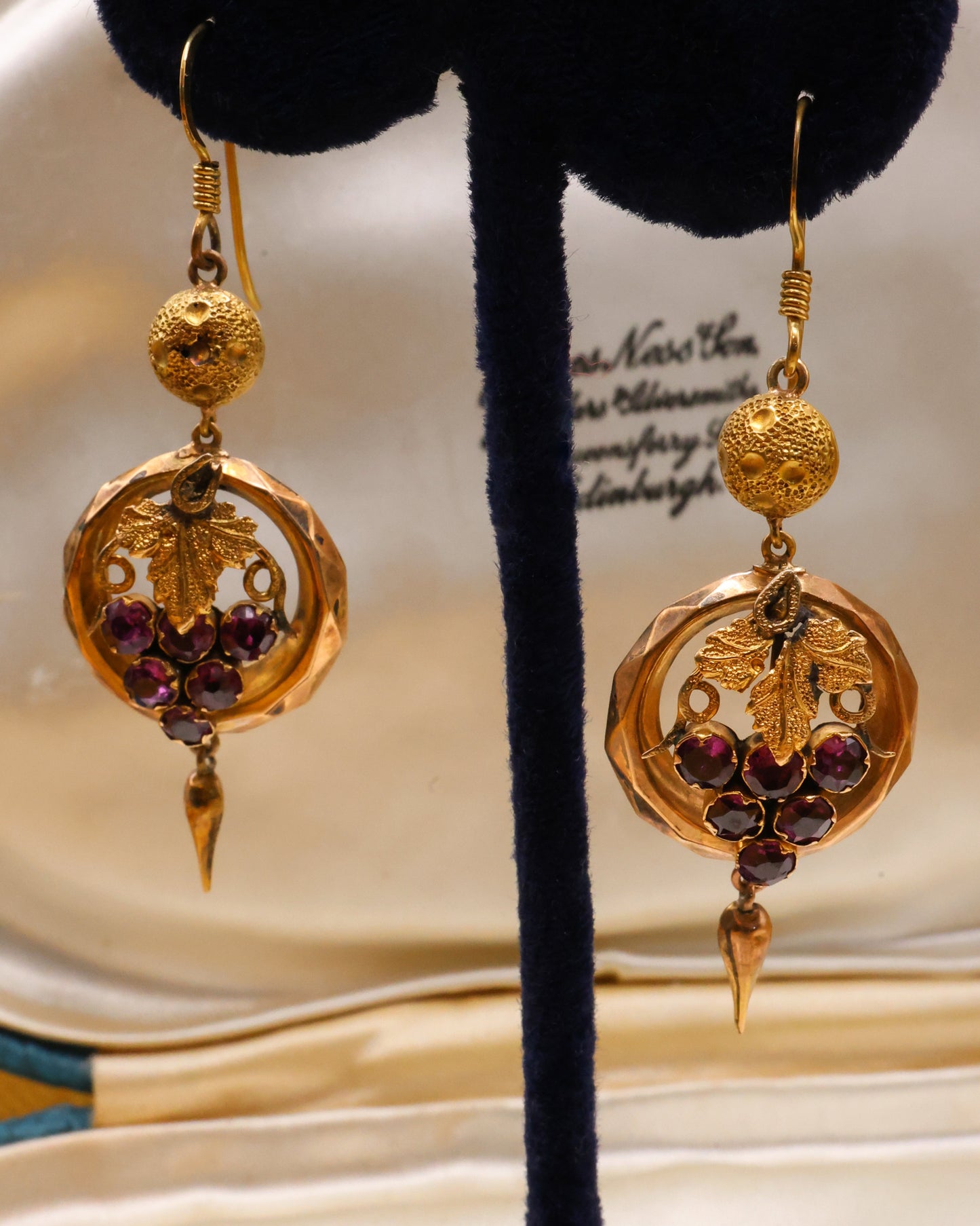 A beautiful pair of Late Victorian 9 Carat Yellow Gold (tested),  Almandine Garnet Drop Earrings with Etruscan Revival & Bacchanalian influences. English Circa 1880