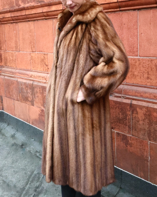 An Exceptional Full Length Demi-Buff, Fully Stranded Mink Coat with wide Raglan Sleeves, tapering to Mandarin Cuffs and a generous Swing Back. Hand made by Lawrence's of Southport. Circa 1990