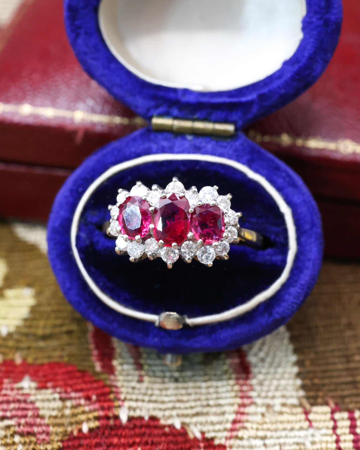 A very unusual 18ct (marked), Yellow Gold & Platinum Tipped, Three Stone  Ruby & Diamond Cluster Ring. Circa 1971