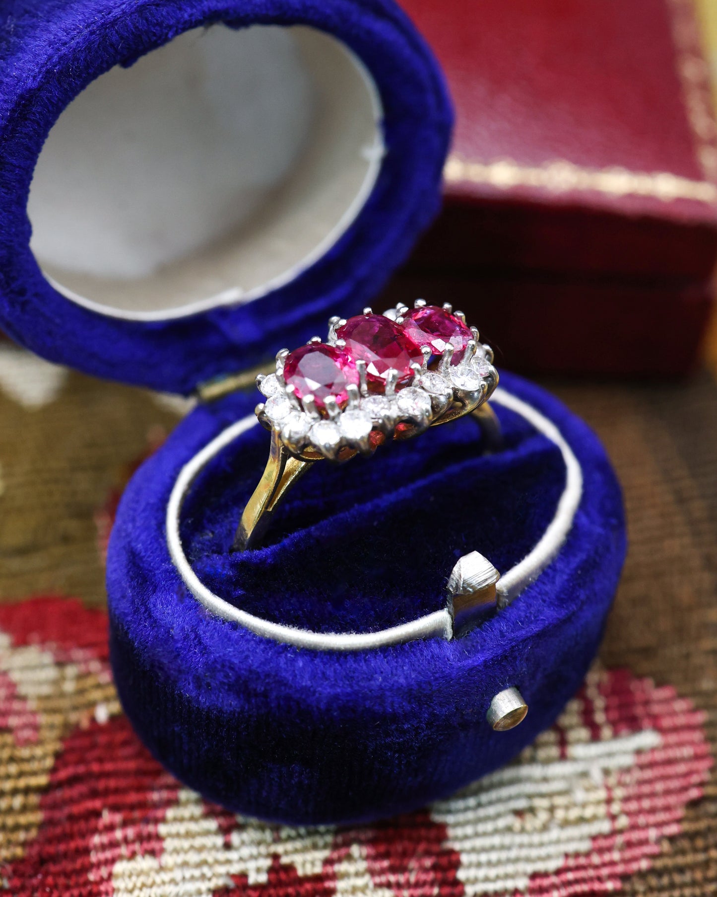 A very unusual 18ct (marked), Yellow Gold & Platinum Tipped, Three Stone  Ruby & Diamond Cluster Ring. Circa 1971