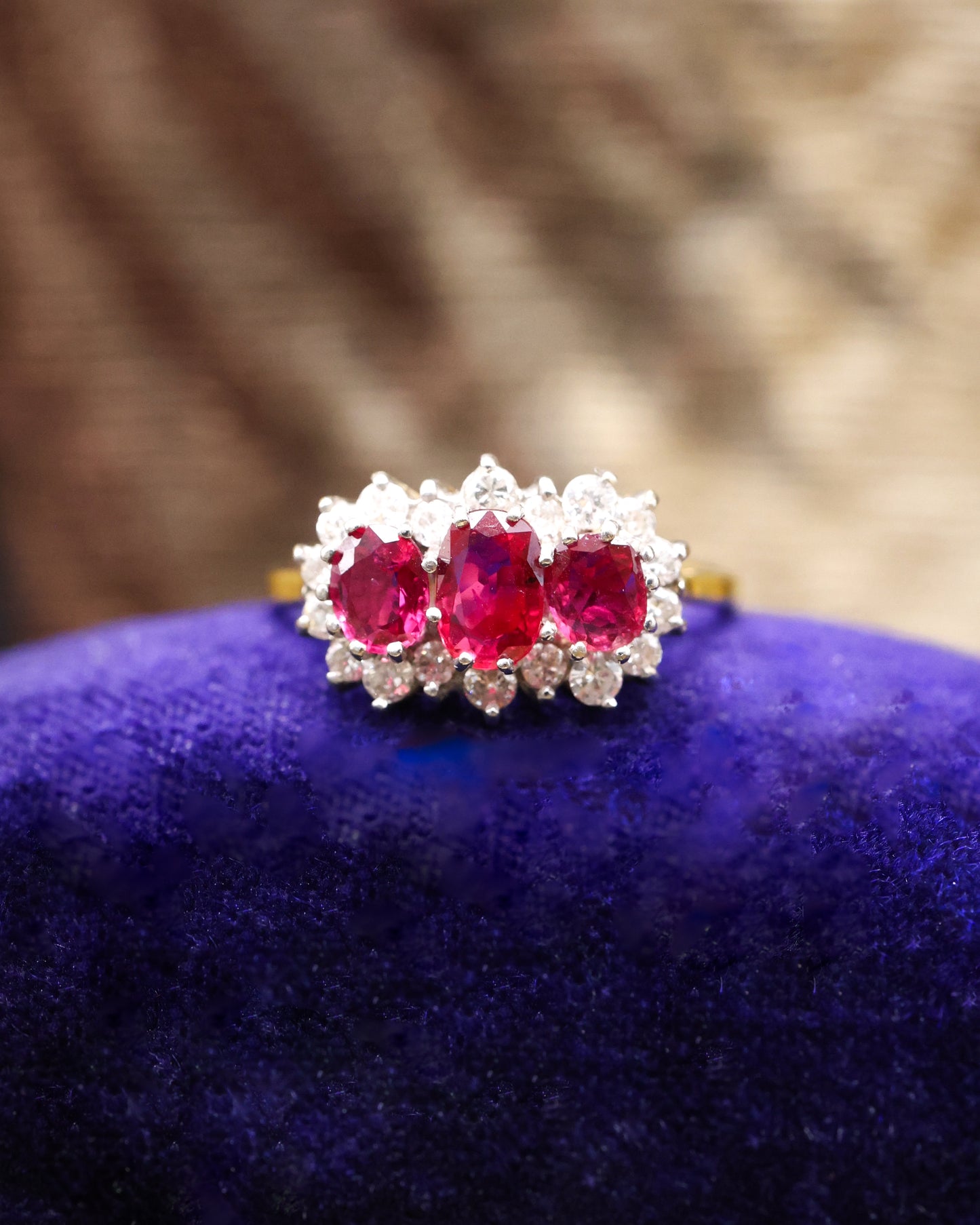 A very unusual 18ct (marked), Yellow Gold & Platinum Tipped, Three Stone  Ruby & Diamond Cluster Ring. Circa 1971