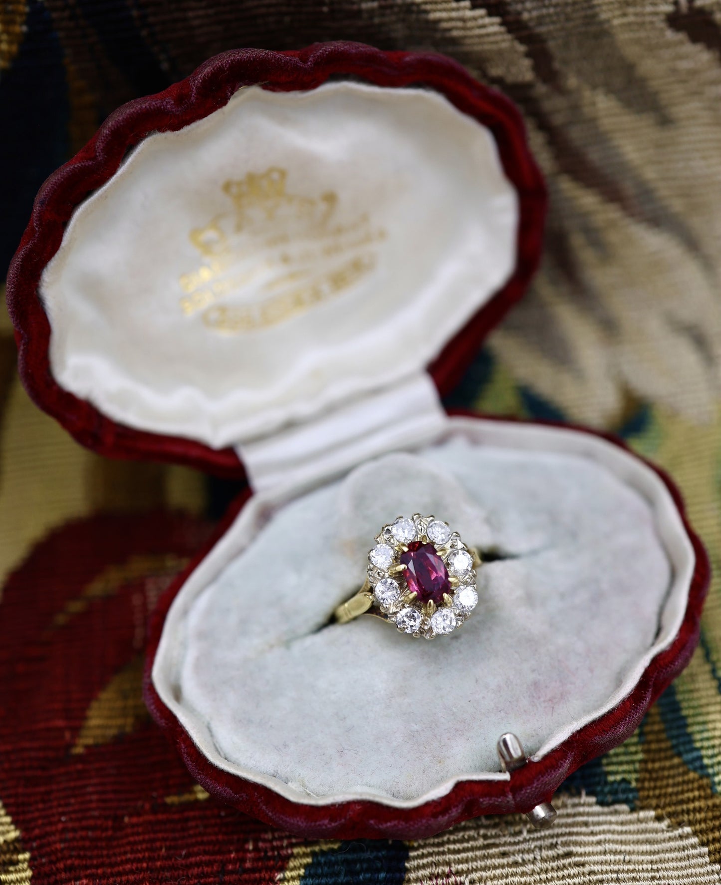 A very fine 18ct Yellow & White Gold Oval 1.35 Carat Siam Ruby & Diamond Cluster Ring. Circa 1975