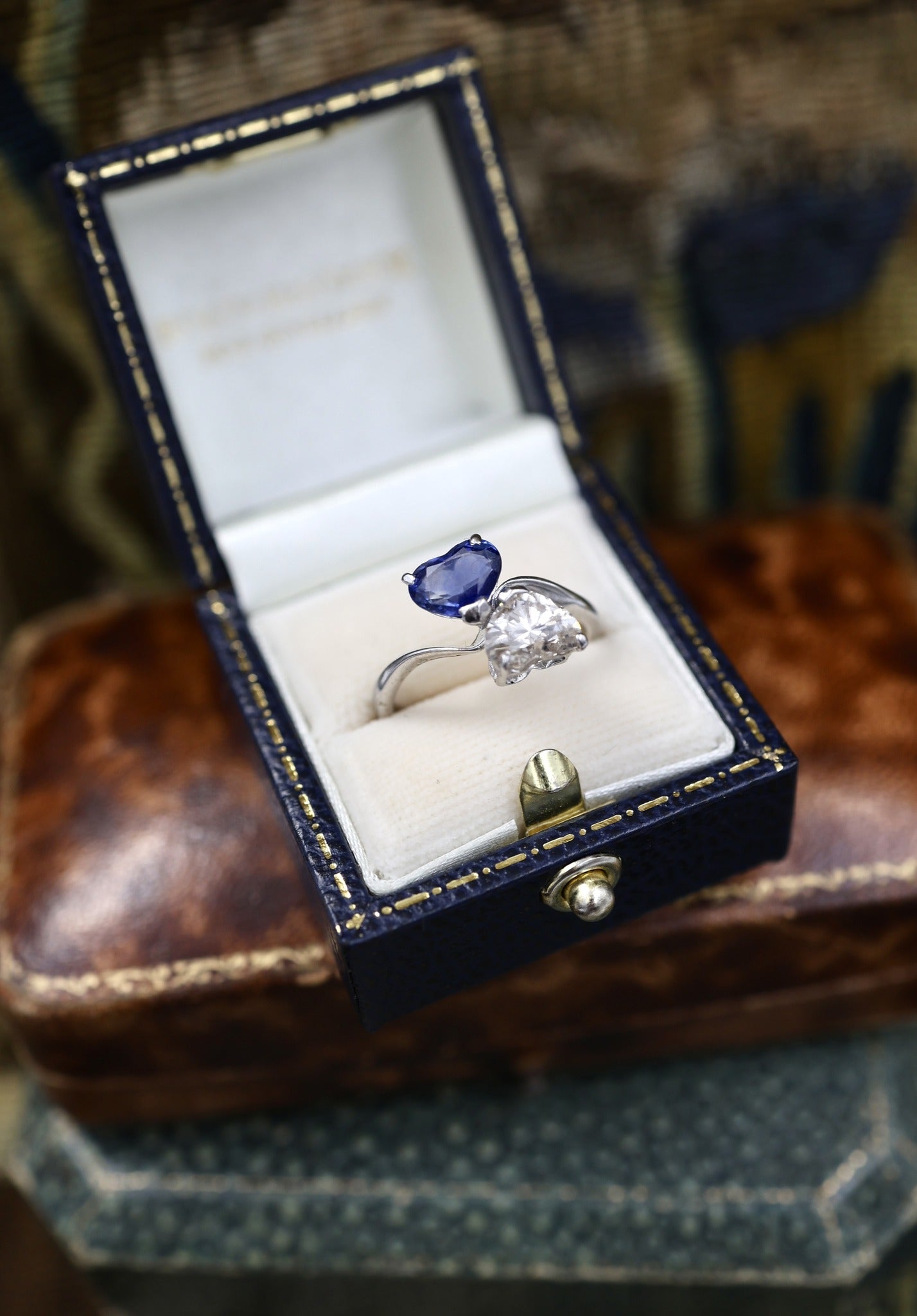 A remarkable 18ct White Gold (French import marks),  Heart Shaped Sapphire & Diamond, Moi et Toi, Two Stone Twist Ring.  Pre-owned