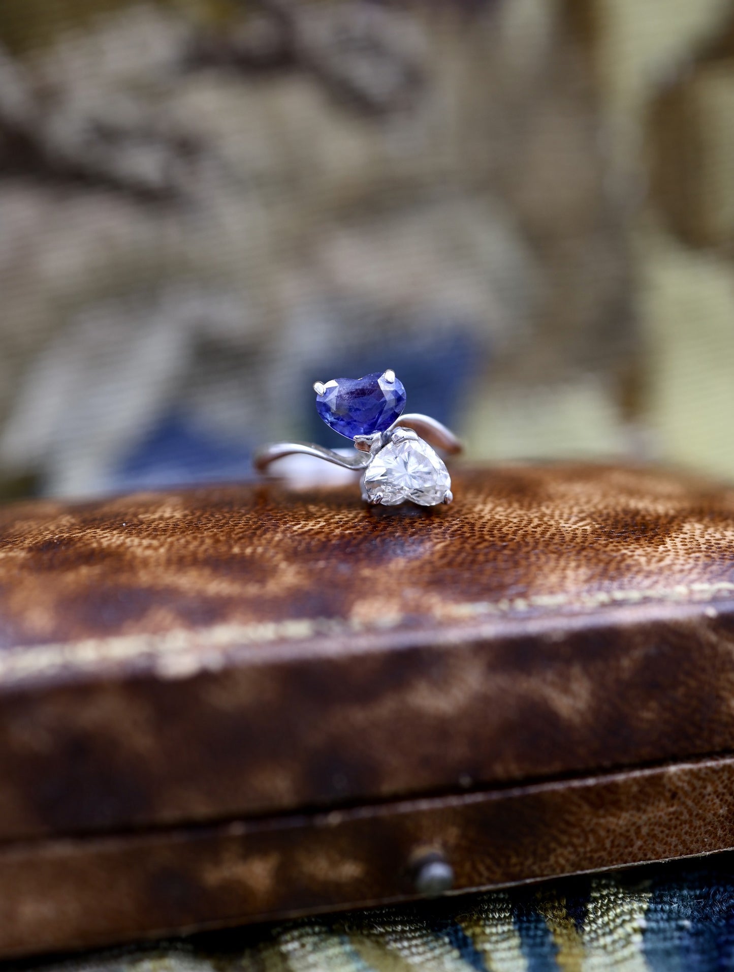 A remarkable 18ct White Gold (French import marks),  Heart Shaped Sapphire & Diamond, Moi et Toi, Two Stone Twist Ring.  Pre-owned