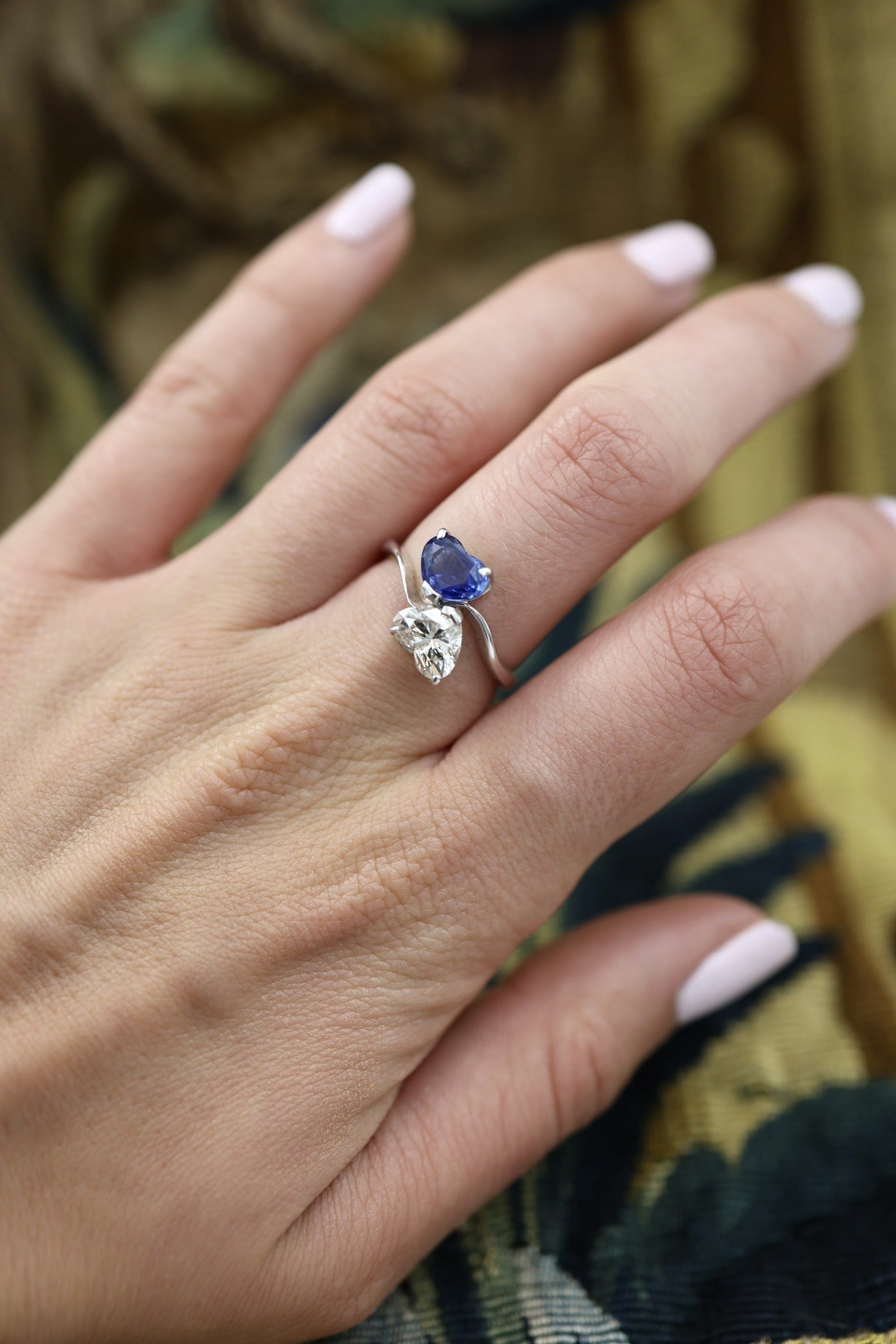 A remarkable 18ct White Gold (French import marks),  Heart Shaped Sapphire & Diamond, Moi et Toi, Two Stone Twist Ring.  Pre-owned