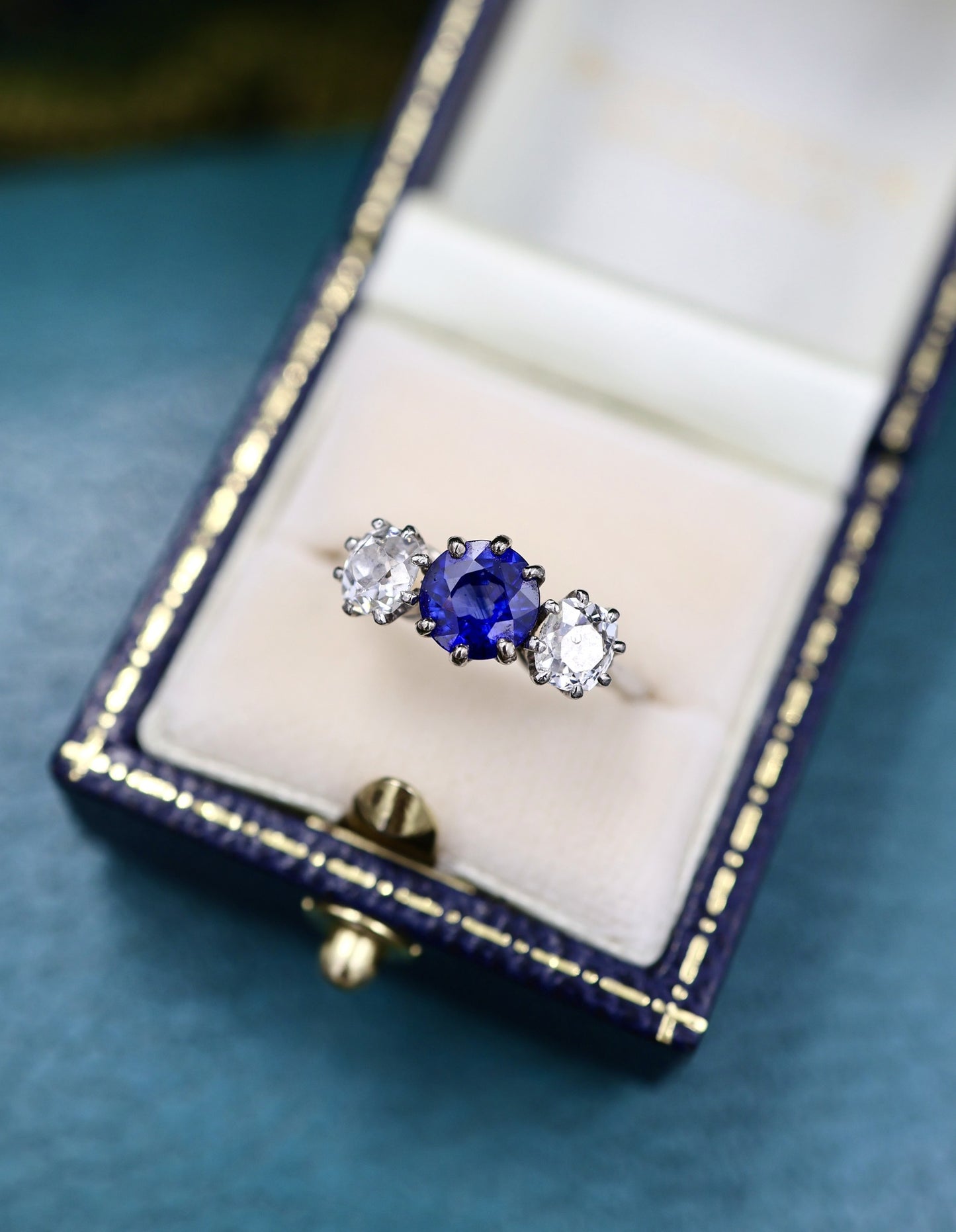 A very beautiful 1.45 Carat Natural Ceylon Sapphire and (two) Old Mine Cut Diamond & Platinum Engagement Ring. Circa 1930