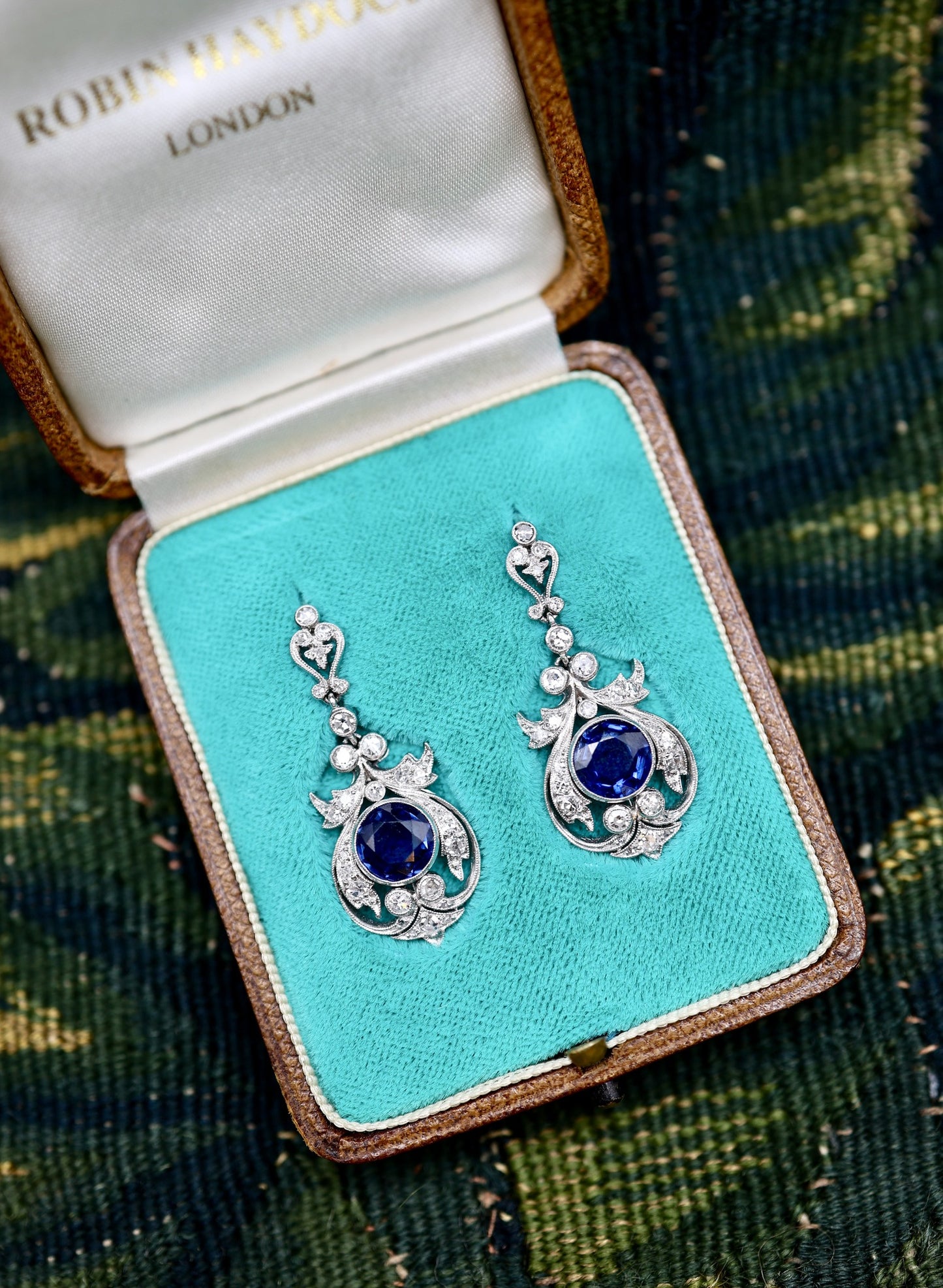 An exceptionally fine pair of Antique Natural Sapphire and Diamond Drop Platinum Earrings, English, Circa 1910.