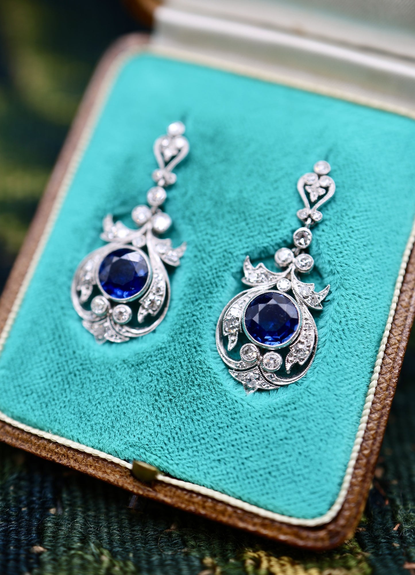 An exceptionally fine pair of Antique Natural Sapphire and Diamond Drop Platinum Earrings, English, Circa 1910.