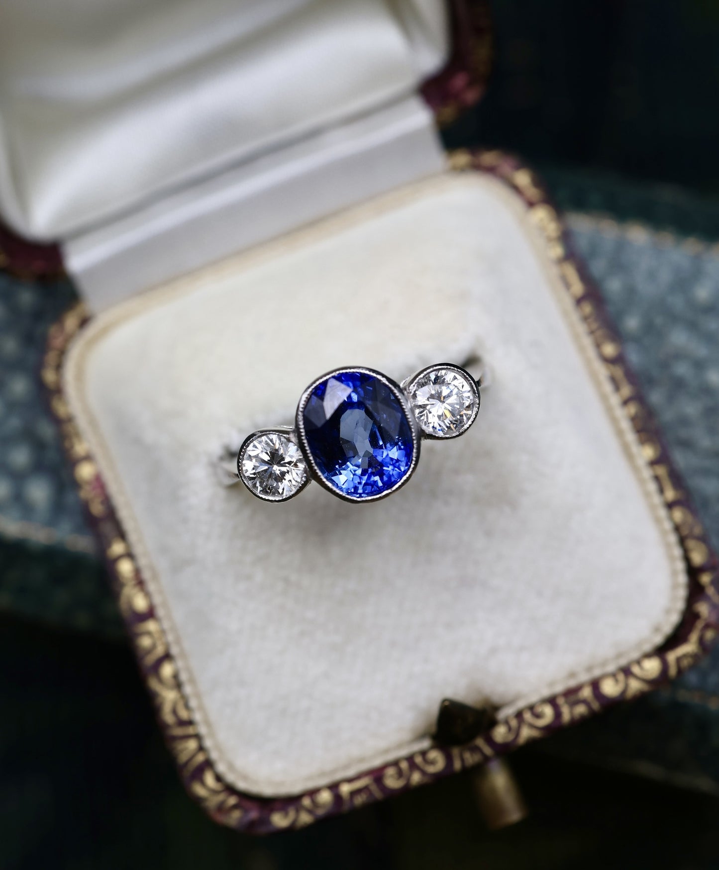 A very fine 18 ct.  White Gold & Platinum Oval 2.40ct Sapphire & Diamond Three Stone Ring. Circa 1935