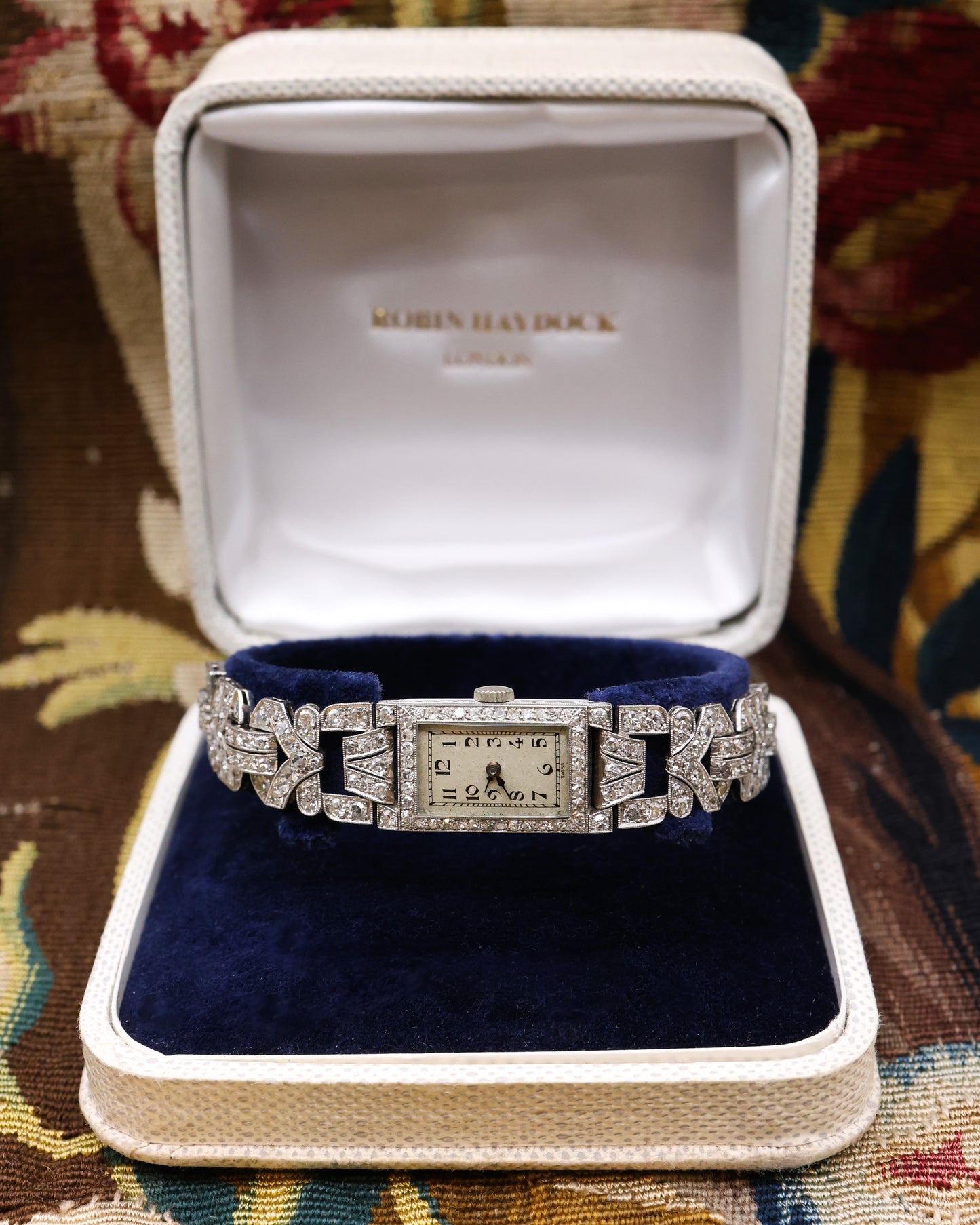A very fine Platinum (tested), Vintage Art Deco Diamond Cocktail Watch with a Diamond set Half-Bracelet. Circa 1930.