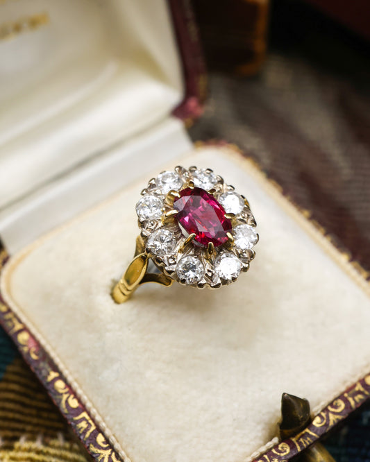 A very fine 18ct Yellow & White Gold Oval 1.35 Carat Siam Ruby & Diamond Cluster Ring. Circa 1975