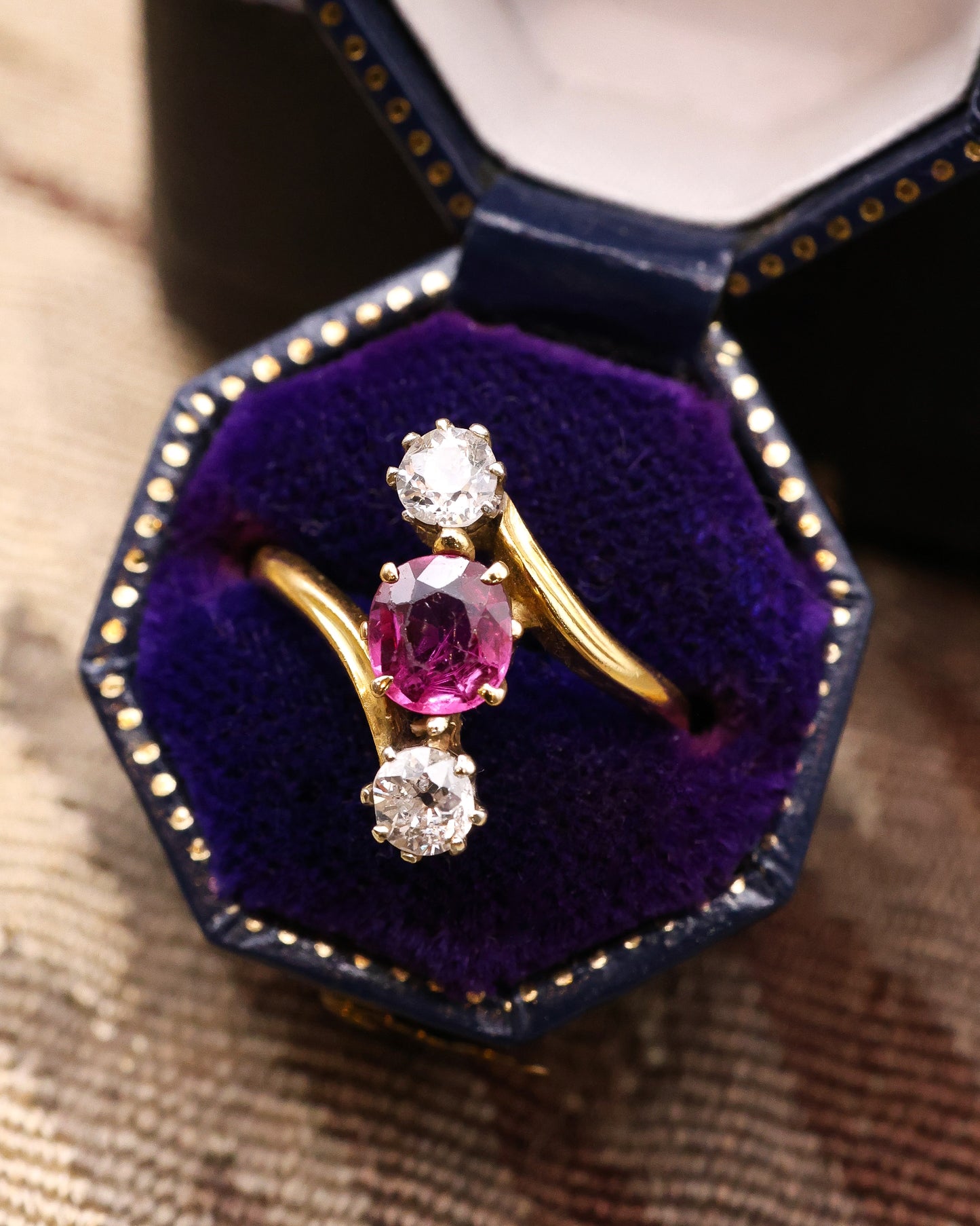 A very fine Vintage Natural and Untreated, 1.20 Carat Ruby & Diamond, Three Stone Crossover Ring, in 18 Carat Yellow Gold (stamped). Circa 1930