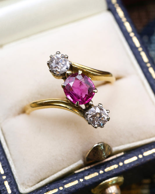 A very fine Vintage Natural and Untreated, 1.20 Carat Ruby & Diamond, Three Stone Crossover Ring, in 18 Carat Yellow Gold (stamped). Circa 1930
