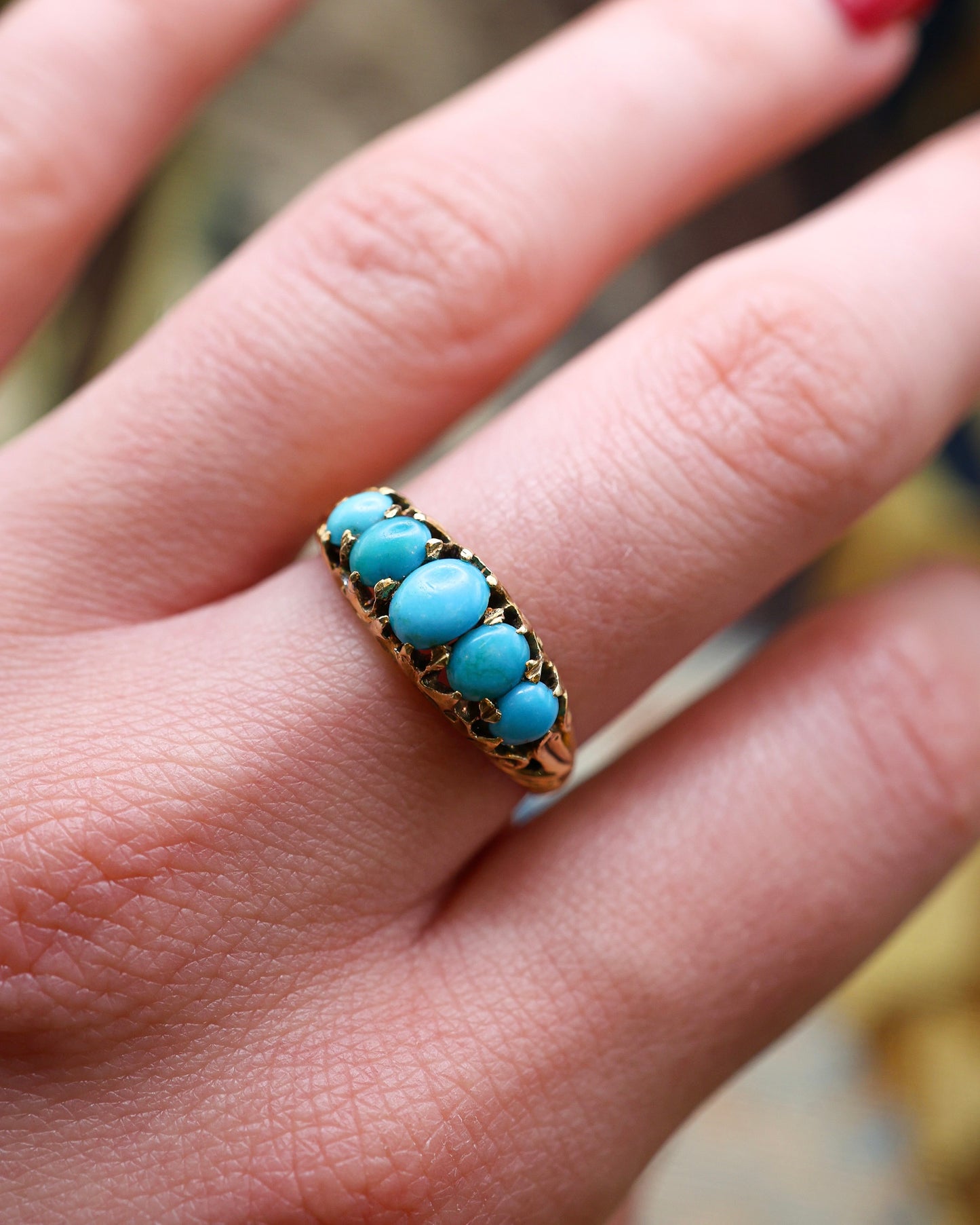 A very fine 15 carat (tested ) Yellow Gold, five stone Turquoise Carved Ring.  English. Circa 1890.