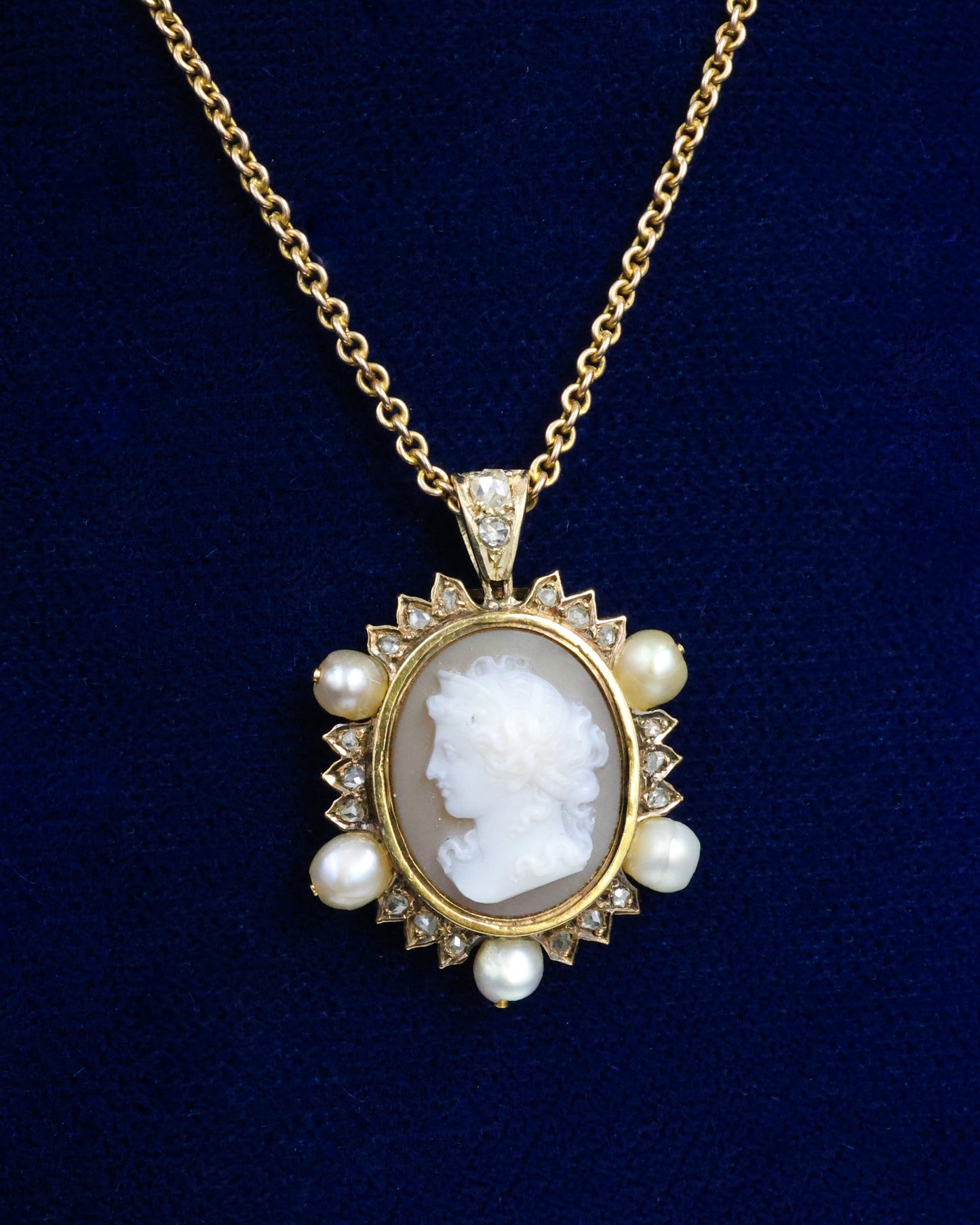 A very fine Hard stone (Carnelian), Cameo Pendant surrounded by five Natural Pearls and Diamonds in 15 carat (tested), Yellow Gold. Circa 1870