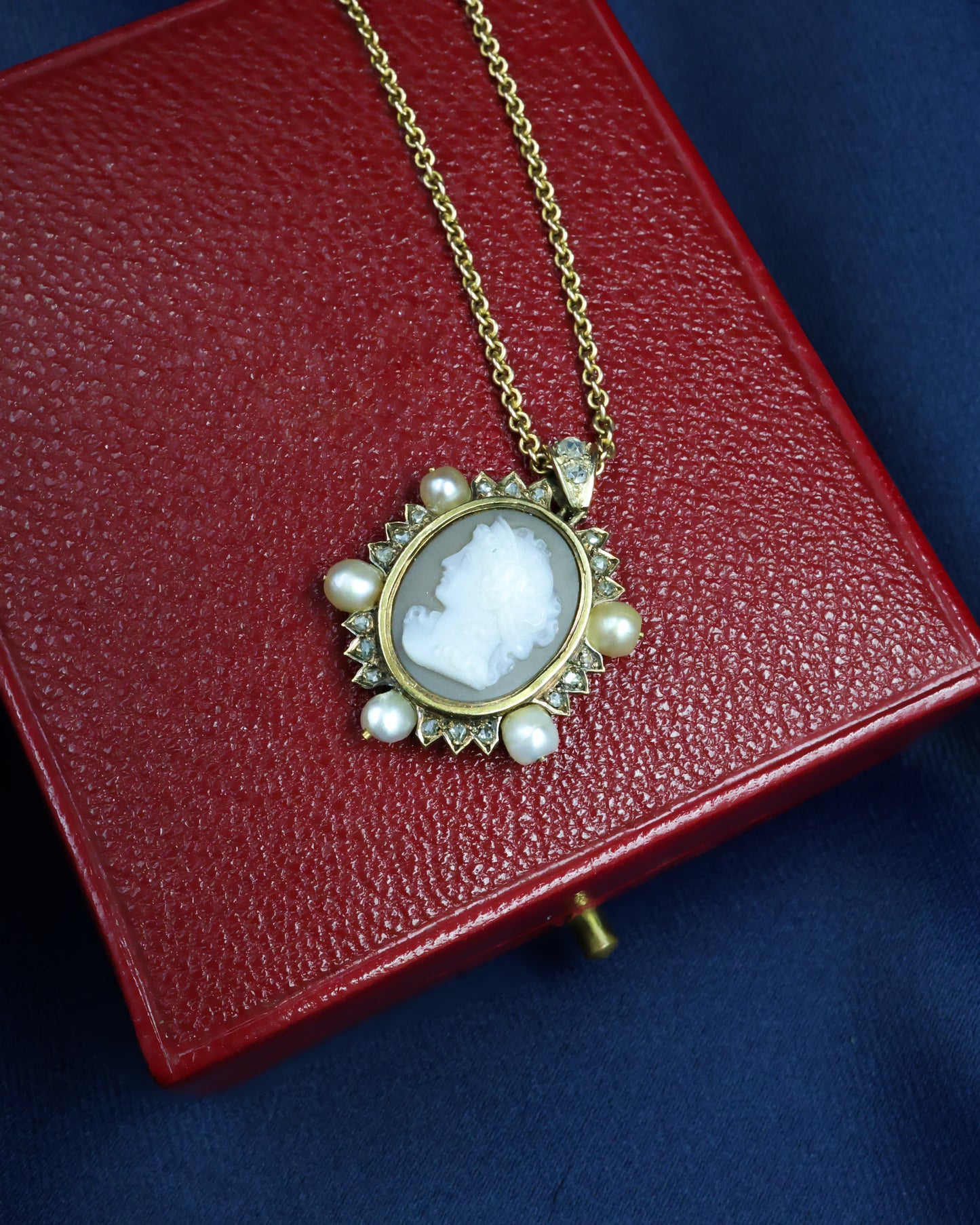 A very fine Hard stone (Carnelian), Cameo Pendant surrounded by five Natural Pearls and Diamonds in 15 carat (tested), Yellow Gold. Circa 1870