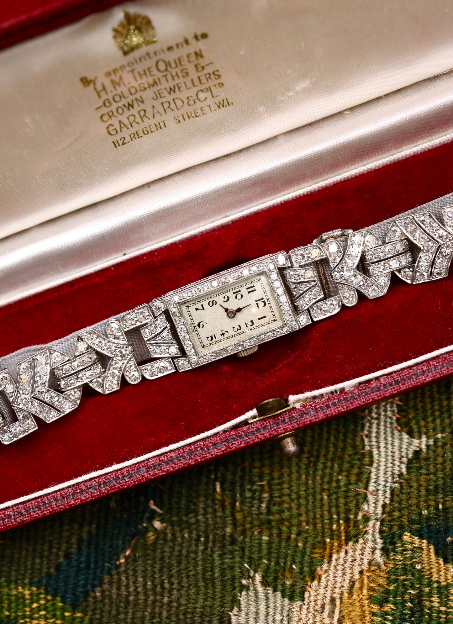 A very fine Platinum (tested), Art Deco Diamond Cocktail Watch with a Diamond set Half-Bracelet. Circa 1930.